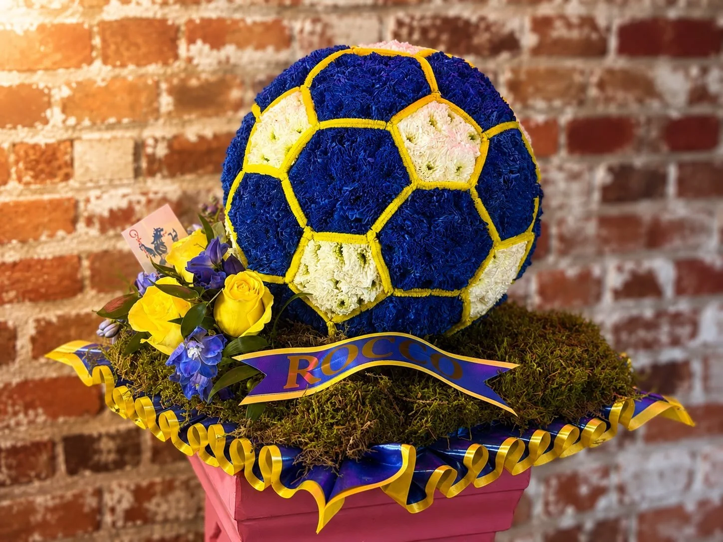 💙💛 A Personal Tribute, Created with Love 💛💙

We recently had the honour of creating this bespoke football floral tribute for a very special farewell.

Handcrafted in striking royal blue, yellow and white, every detail was carefully created to mak