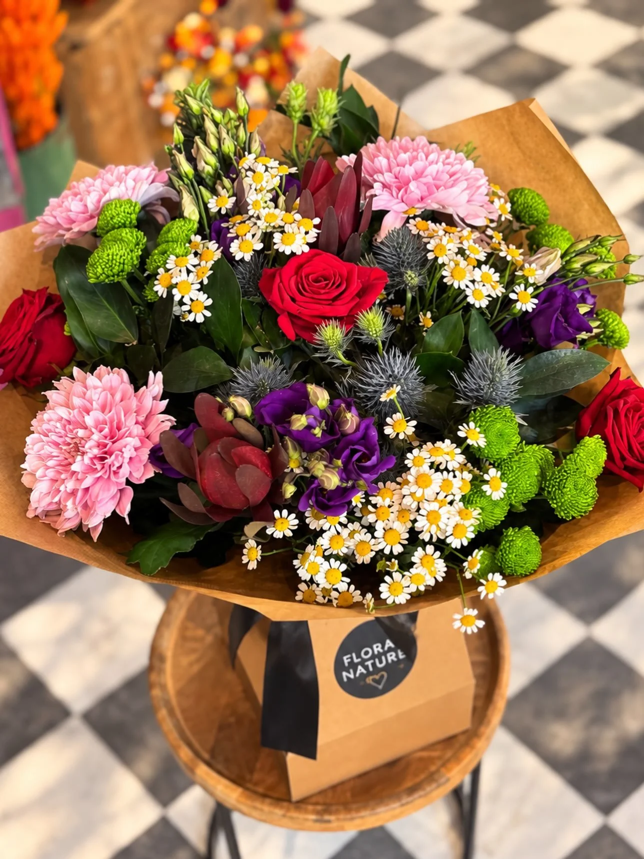 🌸 A bouquet that refuses to go unnoticed. 🌹✨

A gorgeous explosion of colour, texture and personality &mdash; romantic red roses, soft pink blooms, delicate daisies, vibrant greens and rich pops of purple, all brought together in one beautifully wi