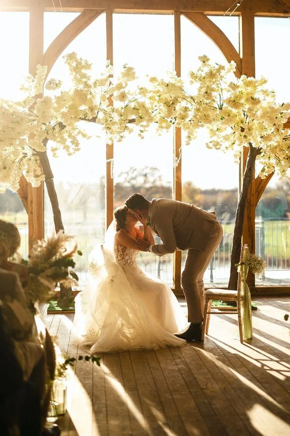 Ellie and Max kiss-Sandburn-Hall.jpeg