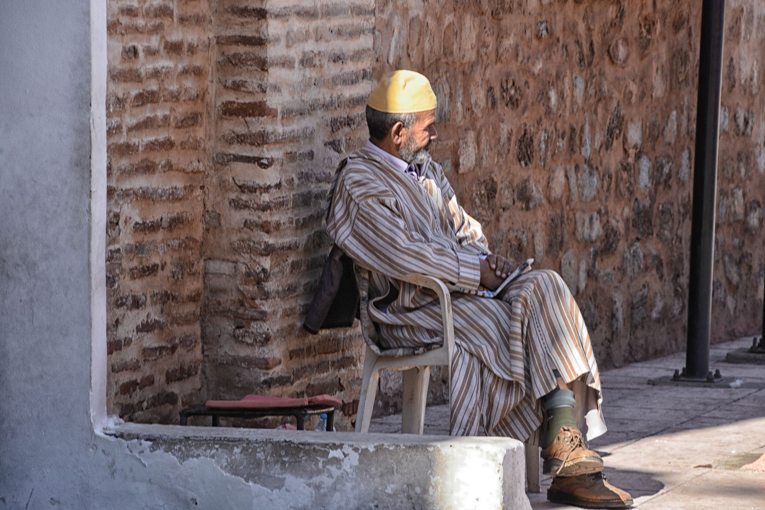 Man Sitting on the Stree flat 2.JPG