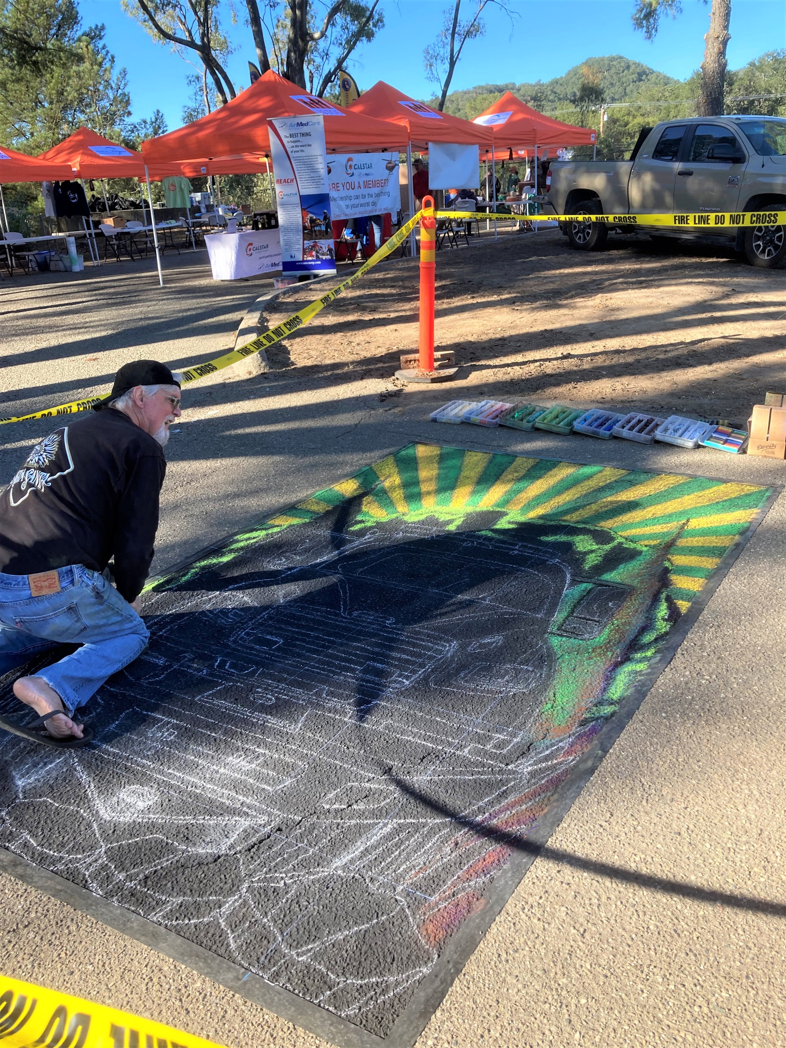 Rod Tryon hard at work, creating his fire truck chalk painting