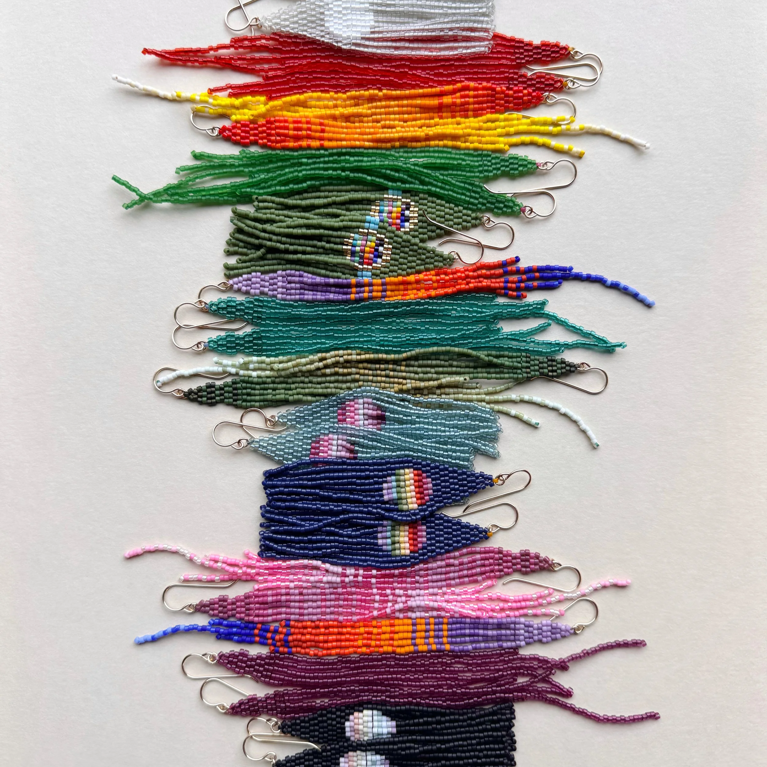 A+woven+Rainbow+of+beaded+earrings.png