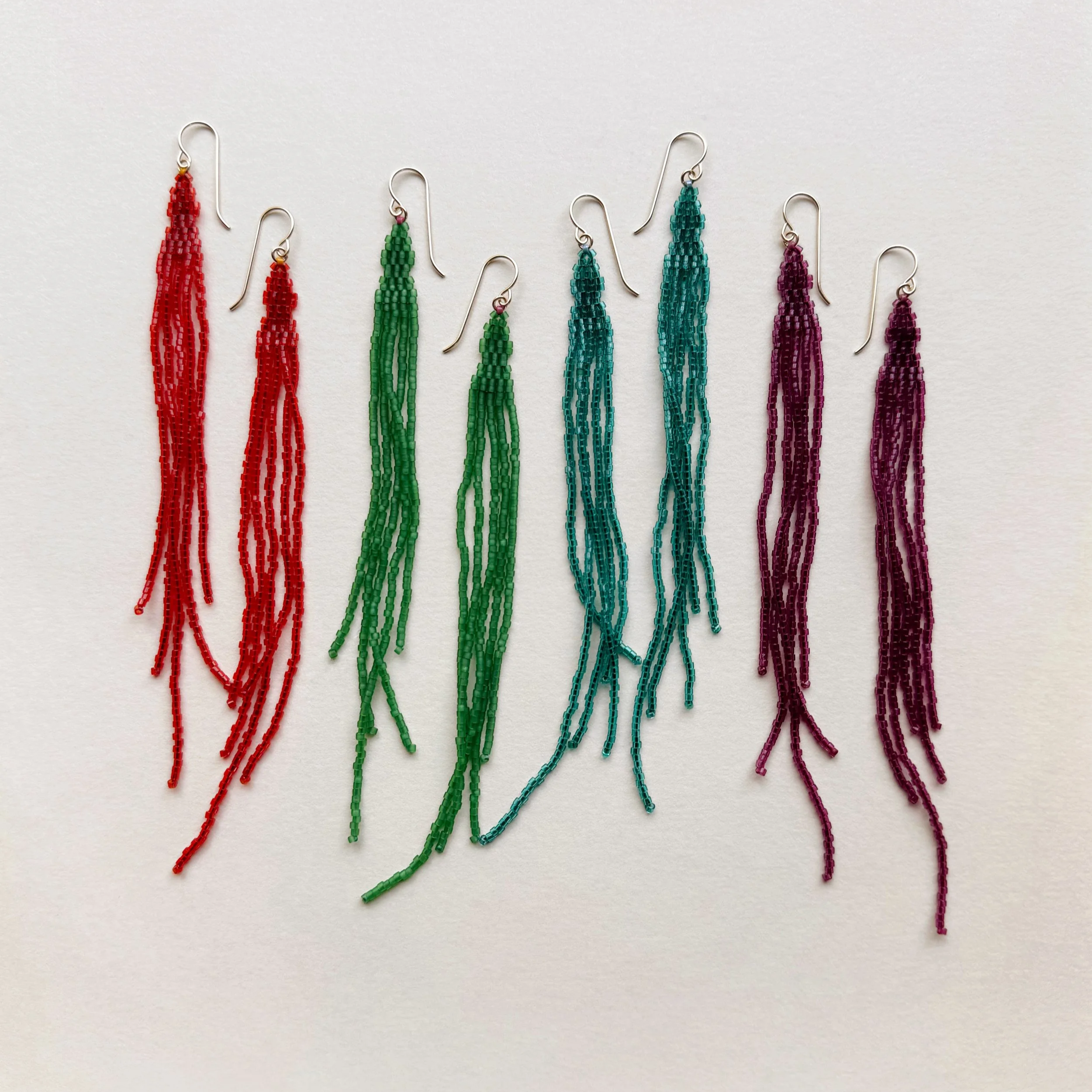 4+pairs+of+Woven+Transparent+Rainbow+earrings.png