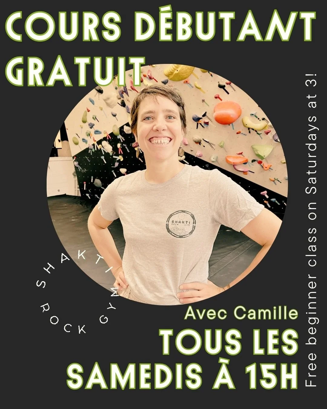 Photo of a female climbing teacher, smiling and looking at the camera.  She's standing in front of a climbing wall