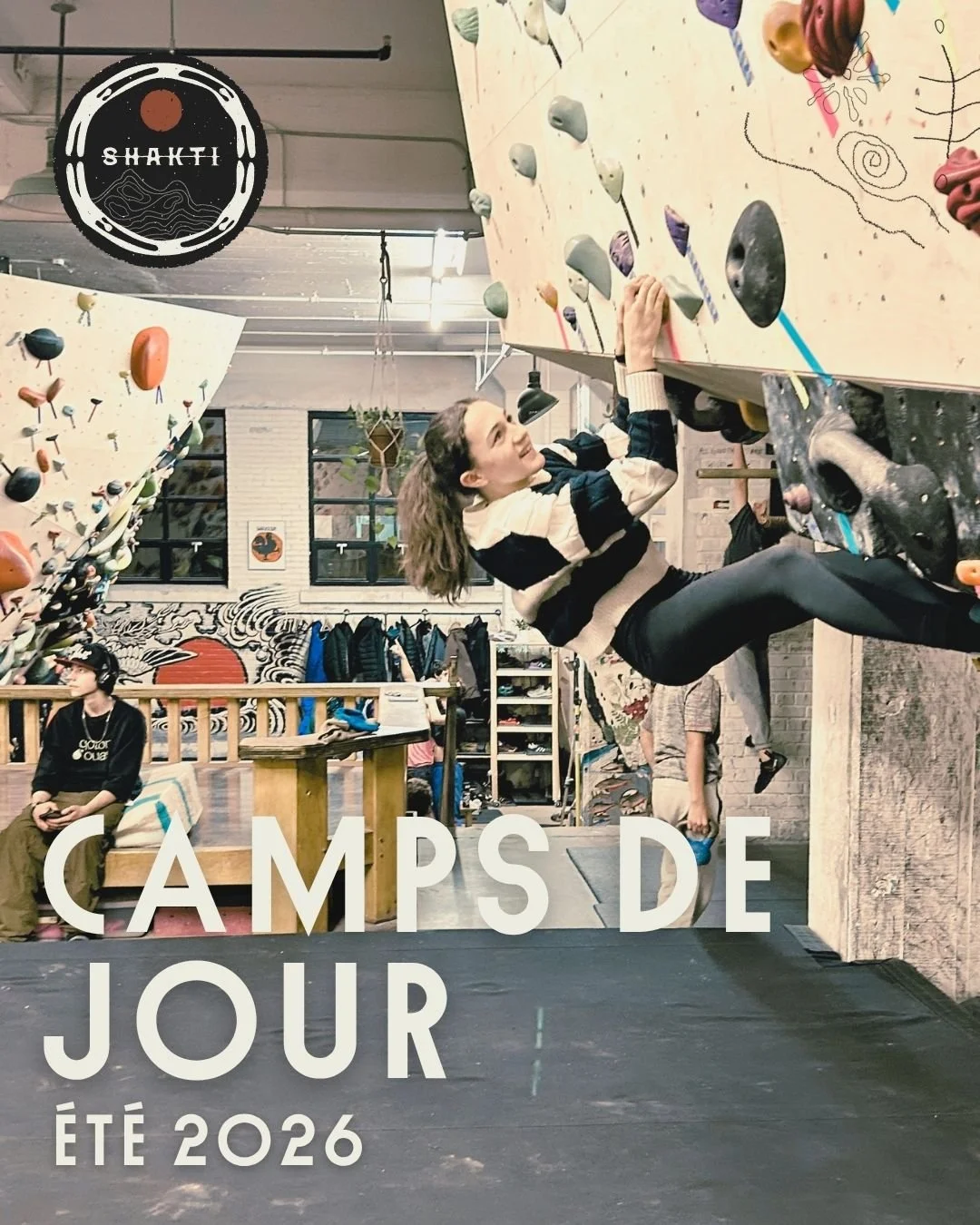 A girl climbing an overhanging route while a boy looks off in the distance