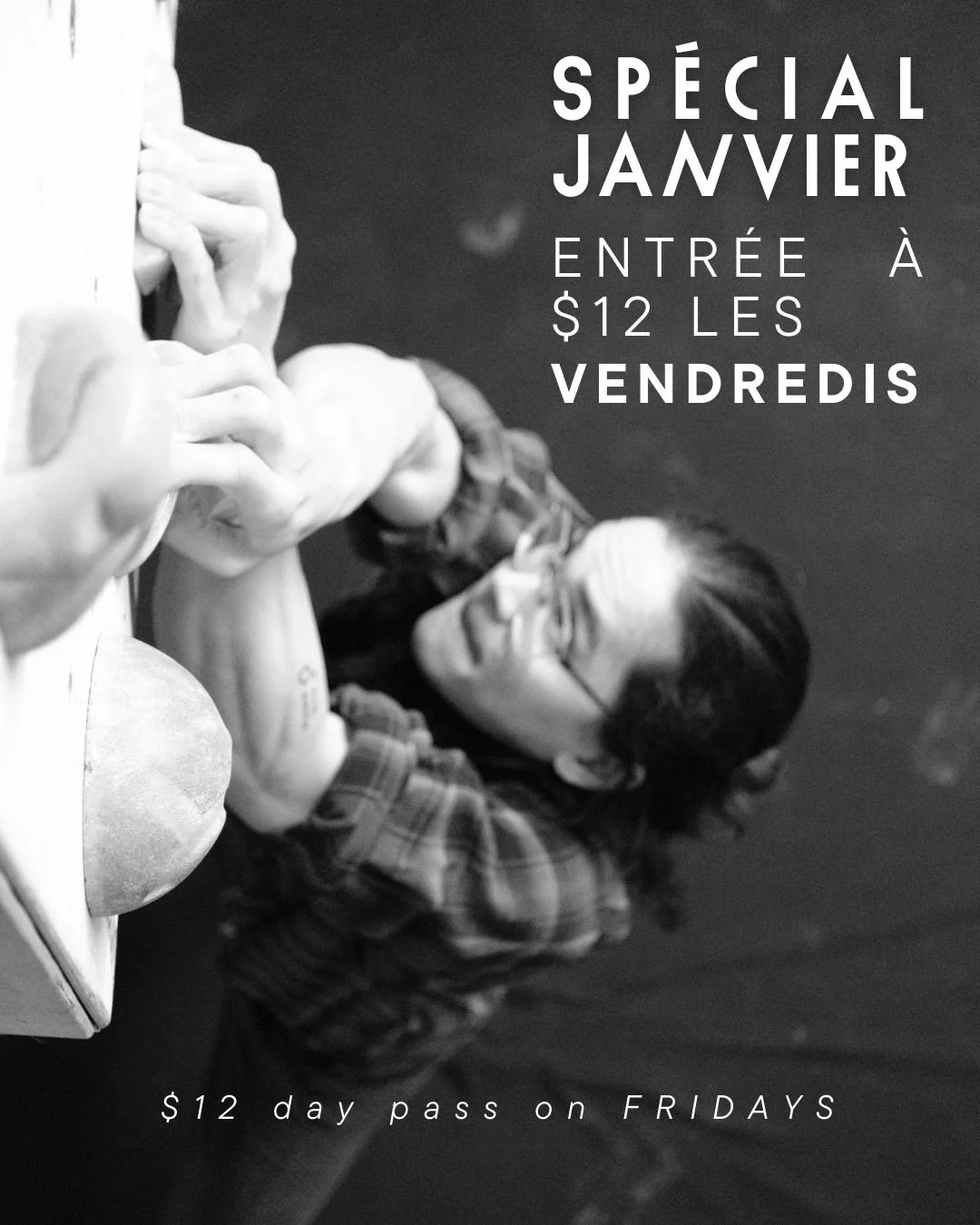 Photo of a young man climbing, looking up towards his next move