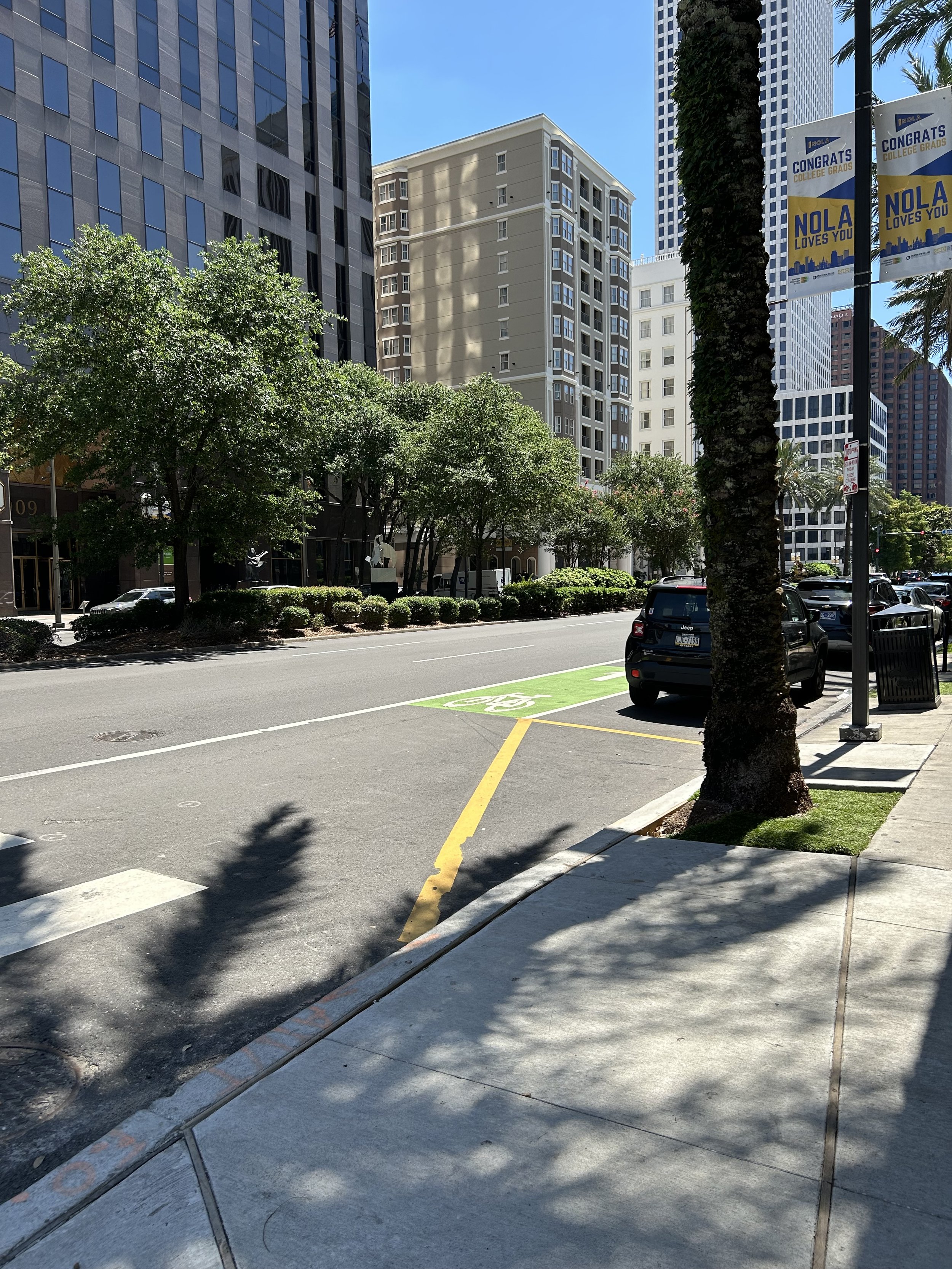 Wide street with office towers in 1980s New Orleans