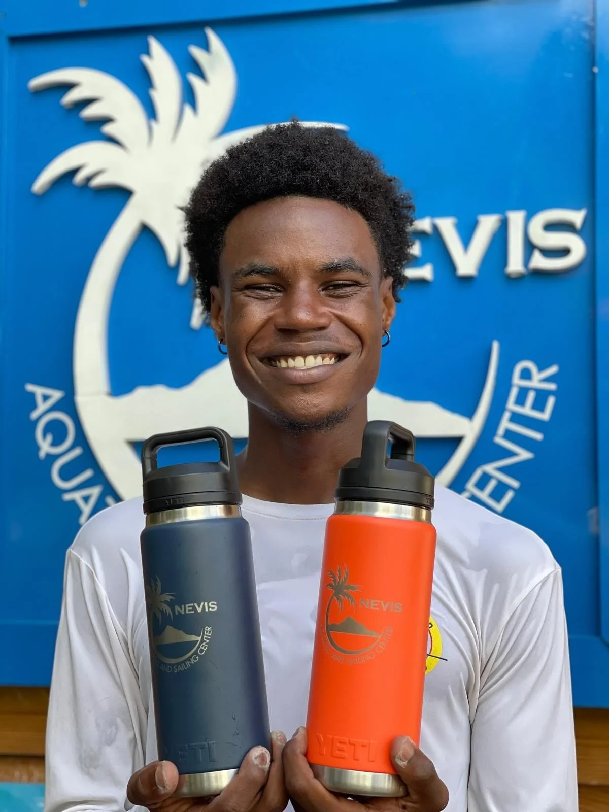 Stay cool, rep Nevis 🌴 and support our youth programs! 💦 Our custom YETI bottles are here in all the colors you love. Every purchase goes straight into helping kids learn to swim and sail. Grab yours today and sip with purpose!