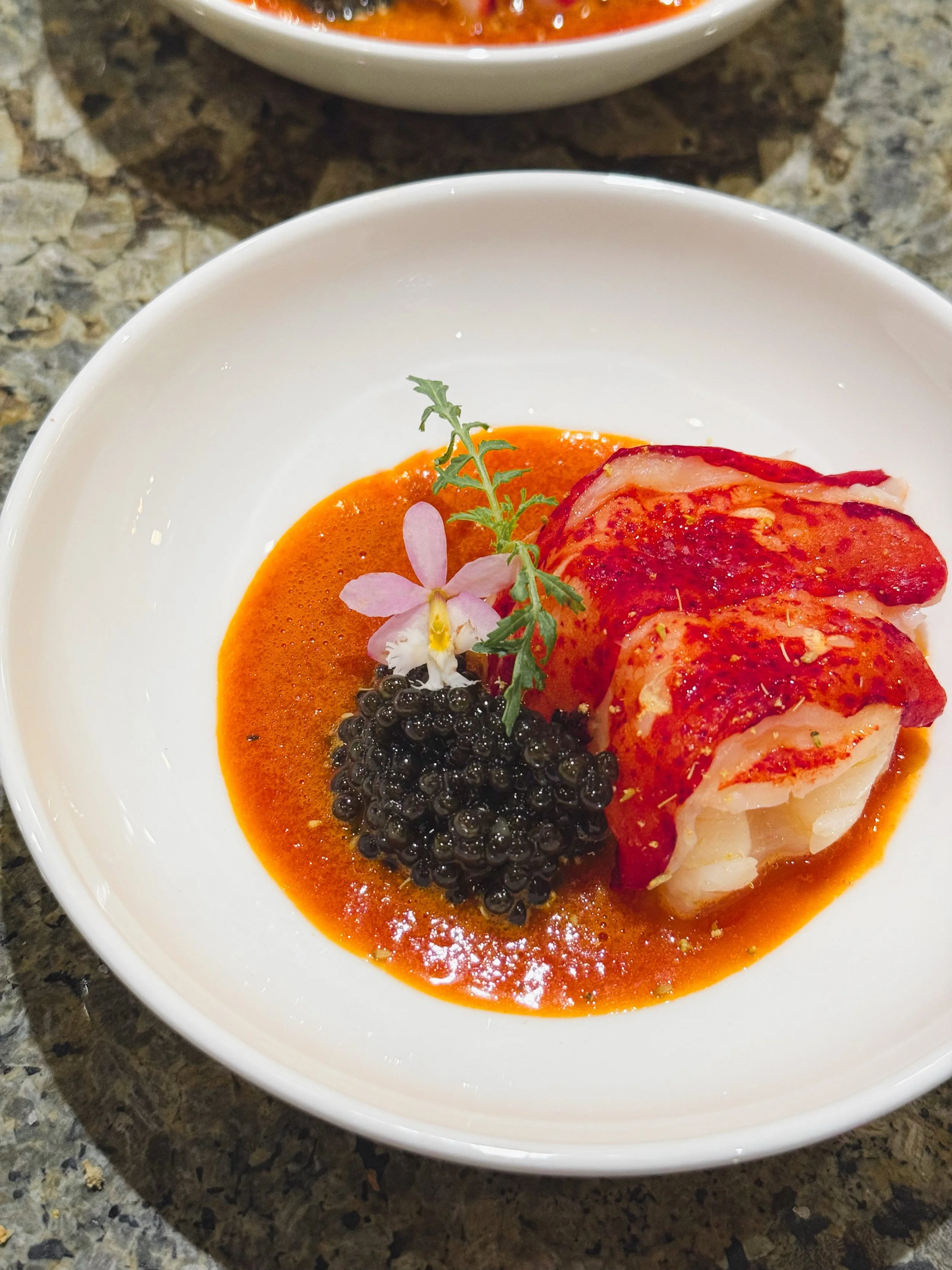 BUTTER POACHED LOBSTER
tomato + saffron broth | osetra caviar | fennel pollen | tangerine lace

Winter menus always bring out some of my favorite flavors and ingredients. This was part of a tasting menu in February. 

Butter poached lobster in a rich