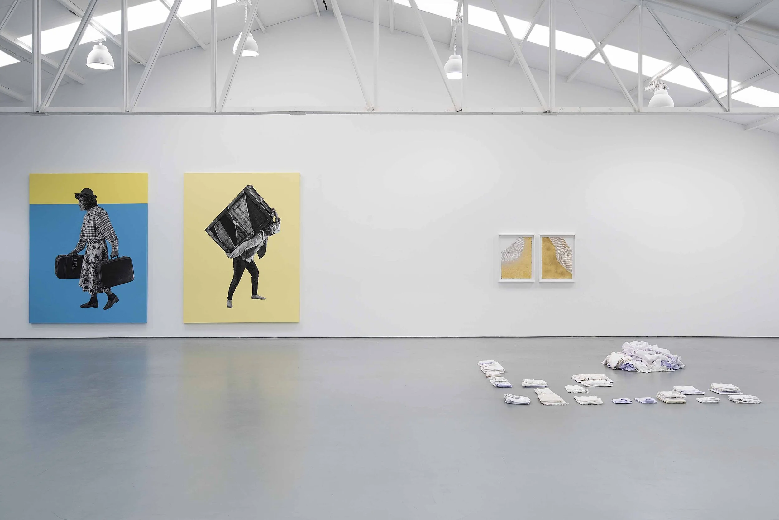 (L-R) Mare, Desierto, 2020. Acrylic house paint on canvas, print on archival cotton paper, barbed wire, galvanized poles, concrete. 9 x 7 feet.