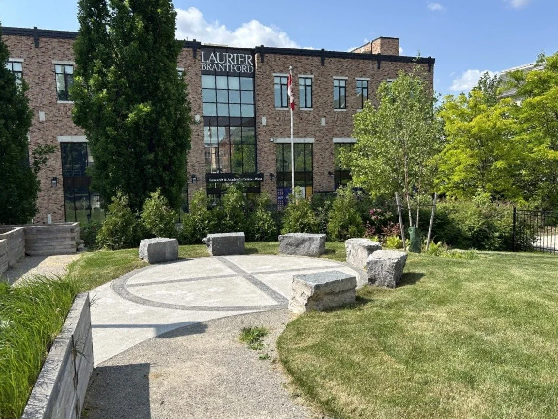 Garden and adjacent building by SpruceLab