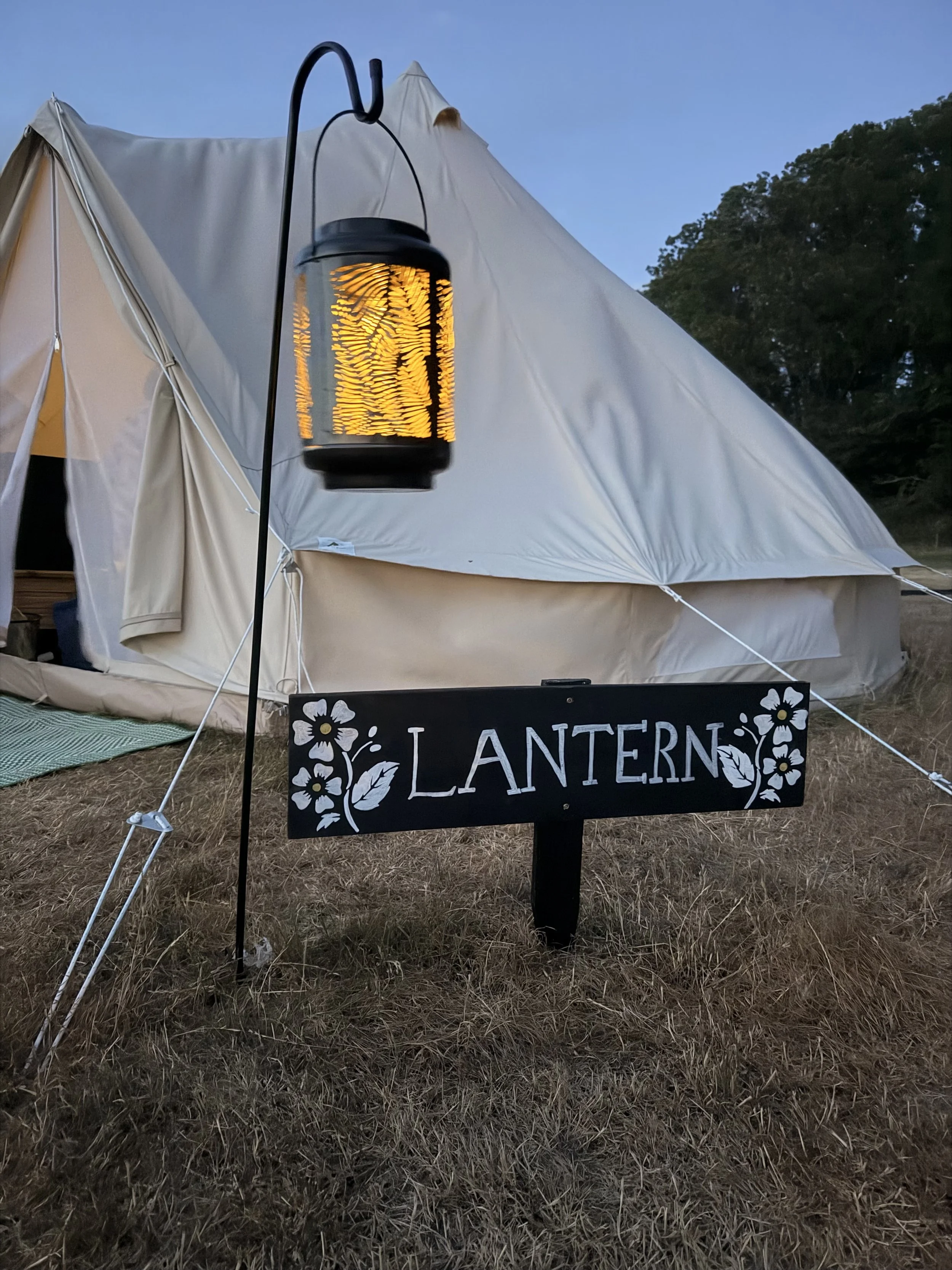Our bell tents are beautifully lit at night with lanterns