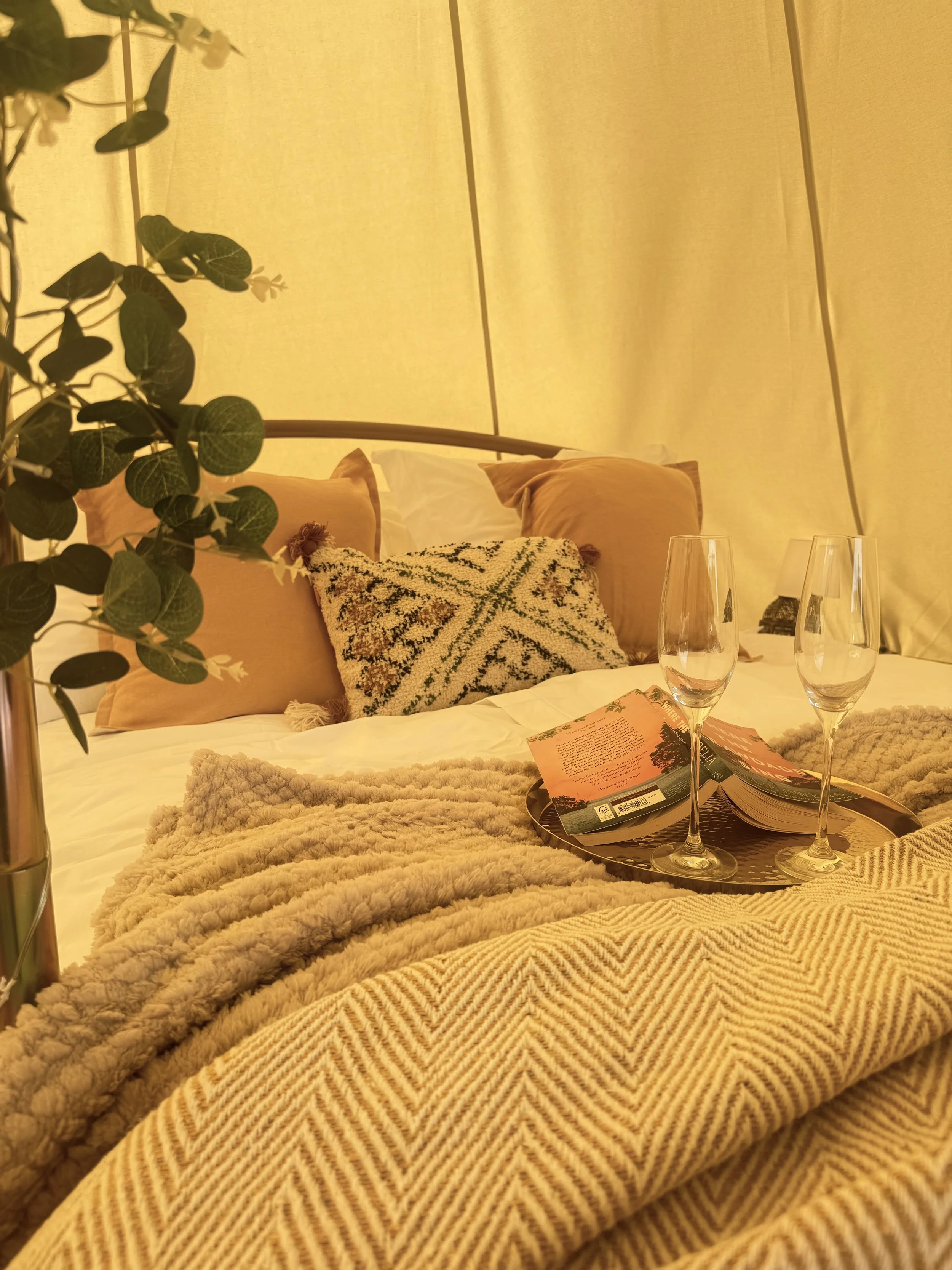 Our bell tents sleep four in a king-size bed and four singles