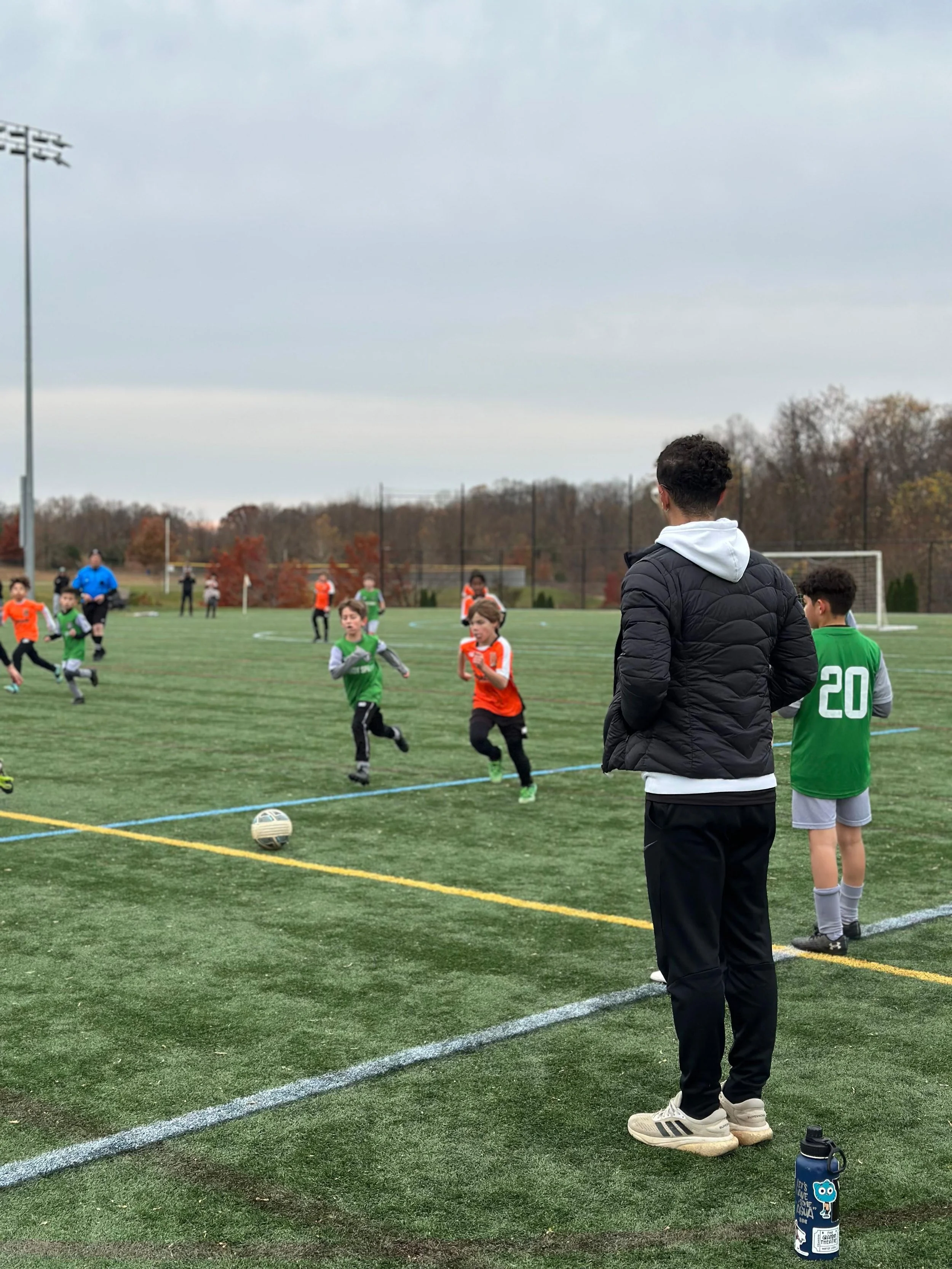 U10 Boys Black_U11 Boys Orange_Coach JL2.jpeg