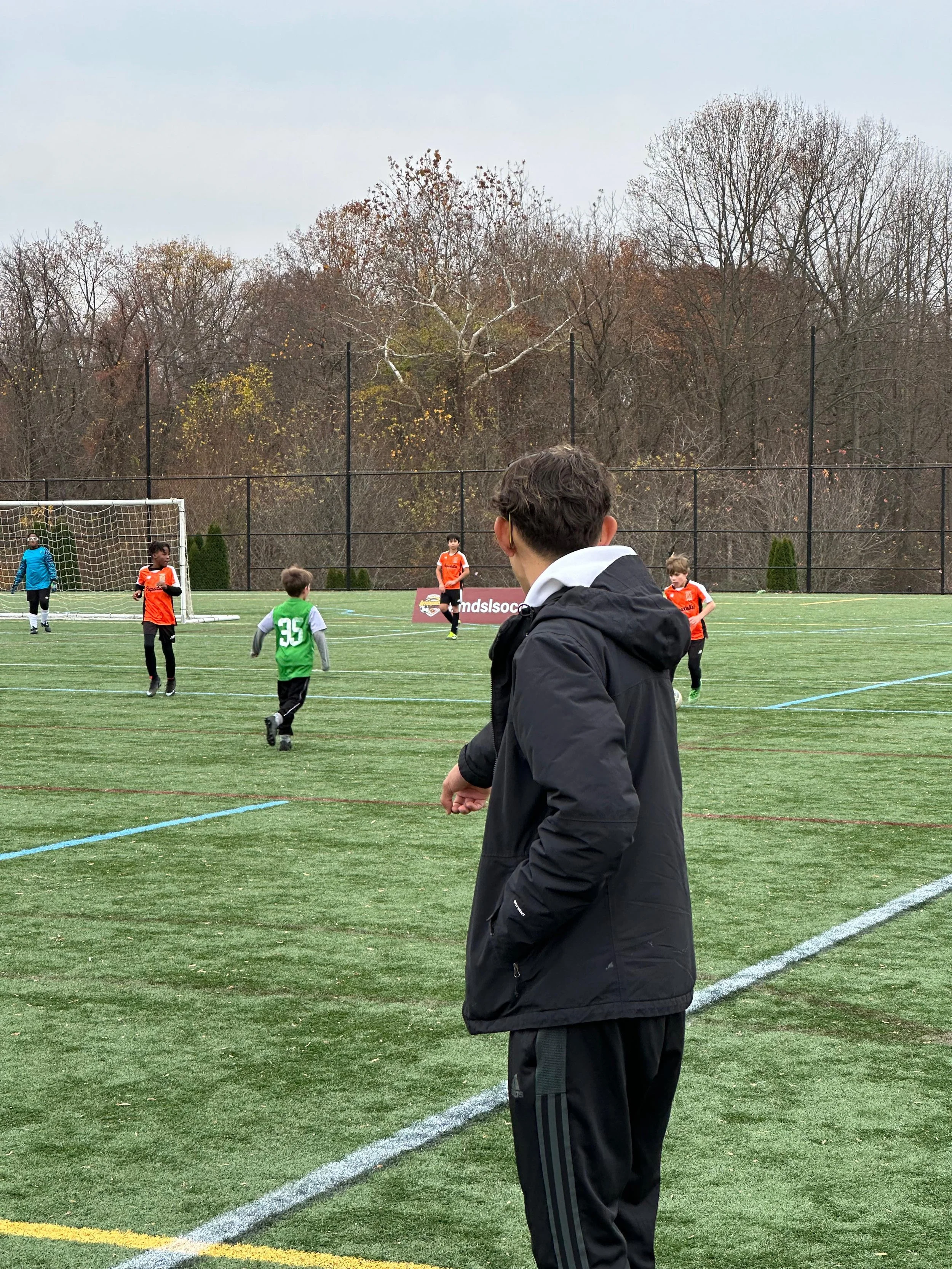 U10 Boys Black_U11 Boys Orange_Coach Nelson.jpeg