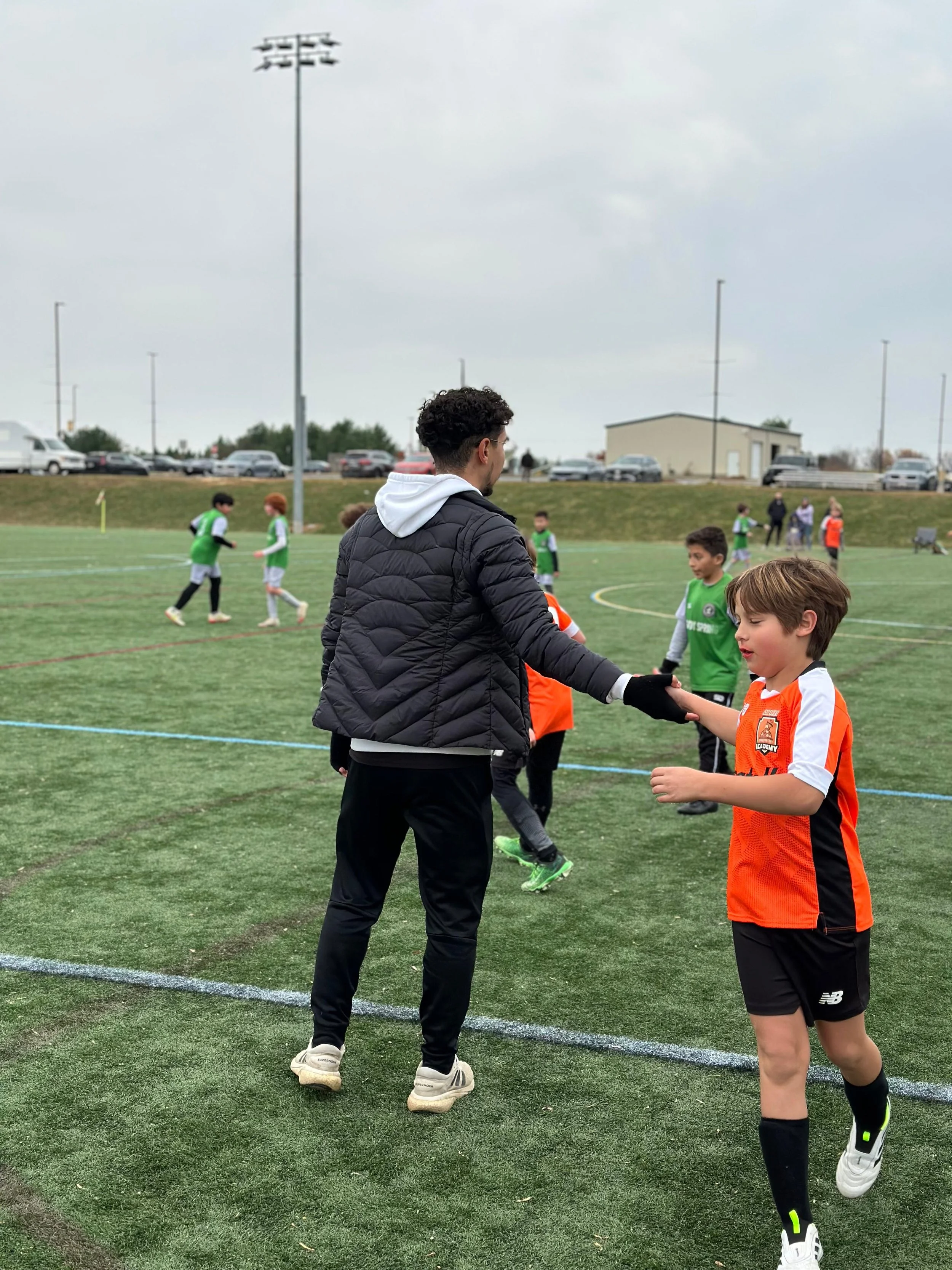 U10 Boys Black_U11 Boys Orange_Coach JL1.jpeg