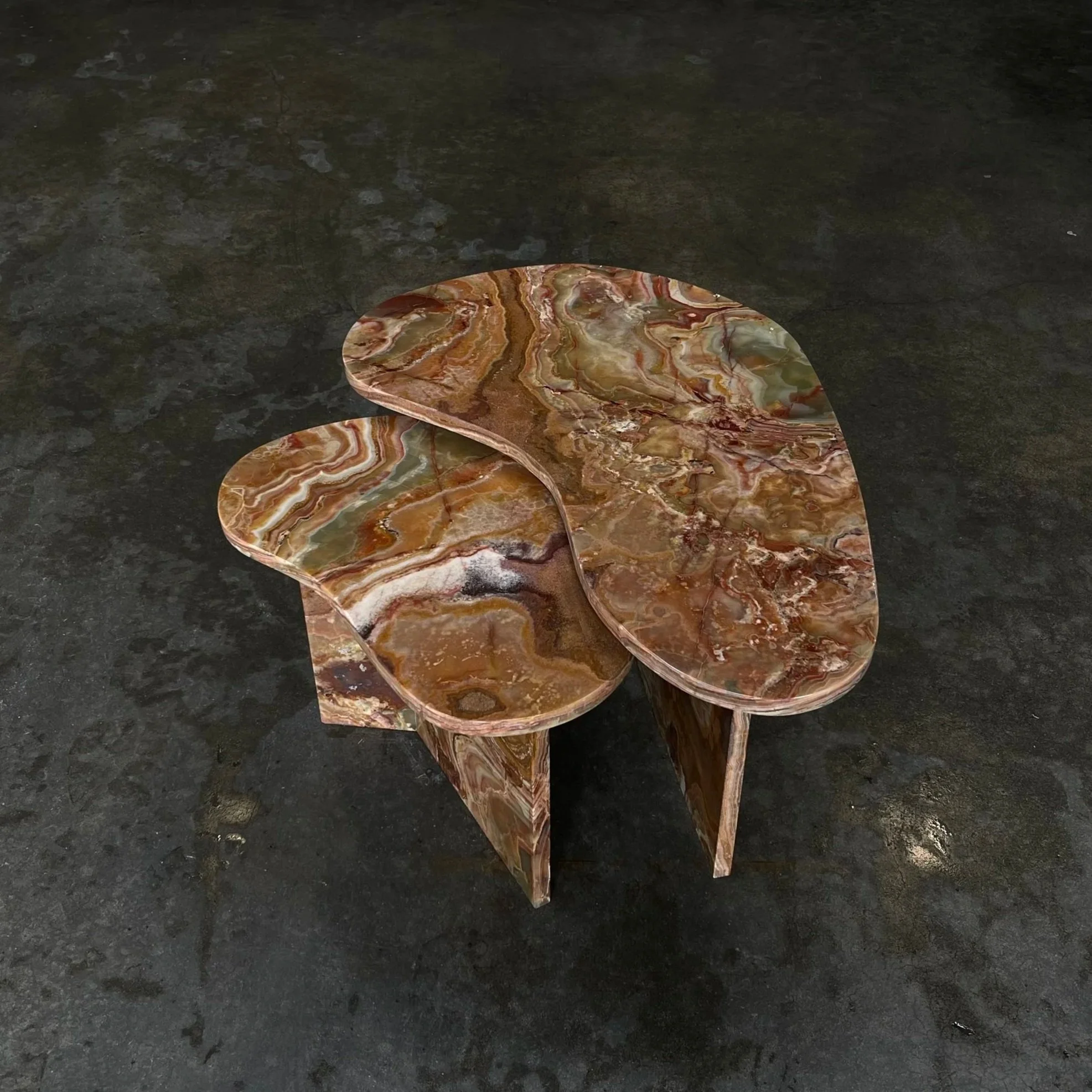 Organic-shaped layered stone table made from richly patterned onyx, designed by Intermarble New York 