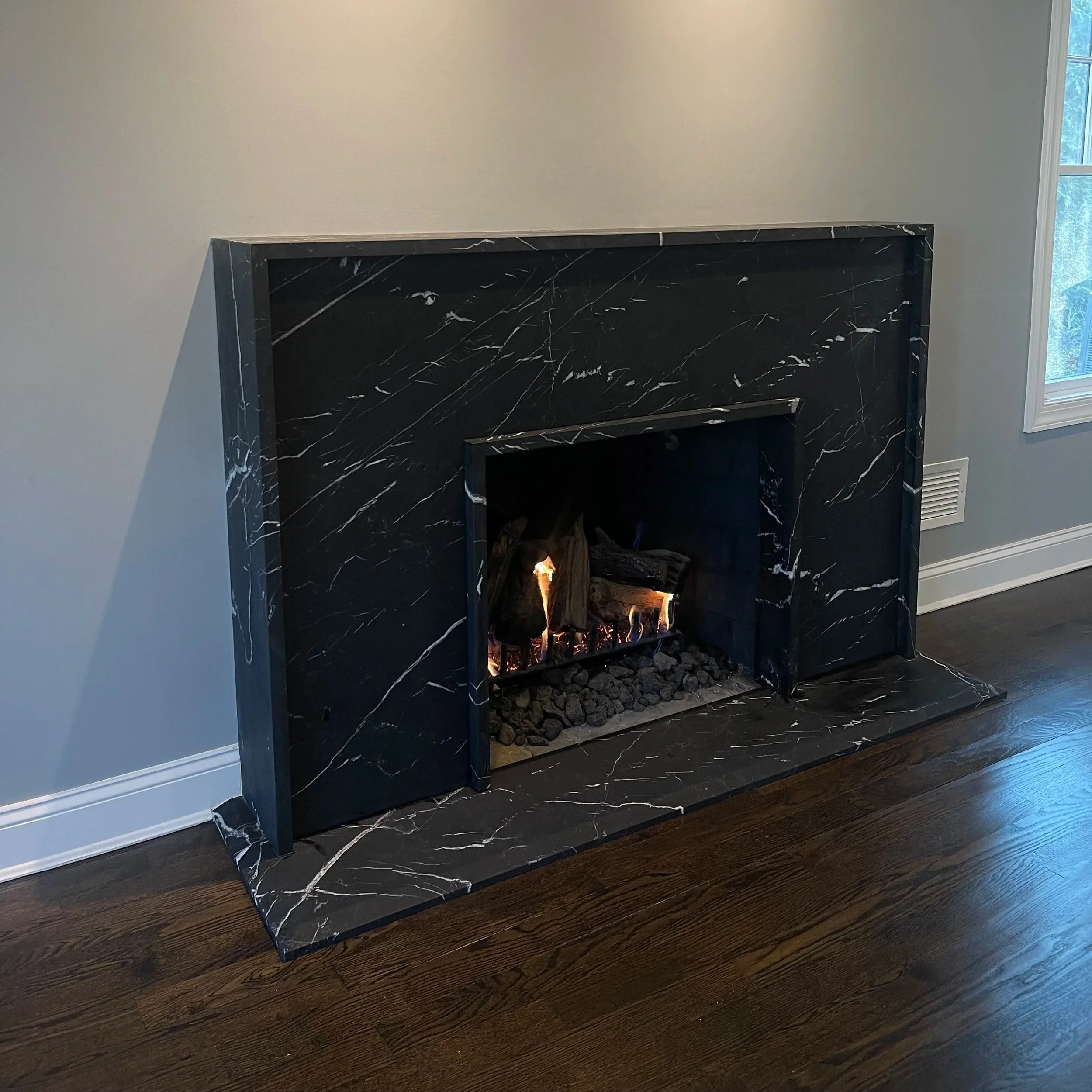 Mitered marble fireplace surround and hearth by Intermarble in Long Island, NY