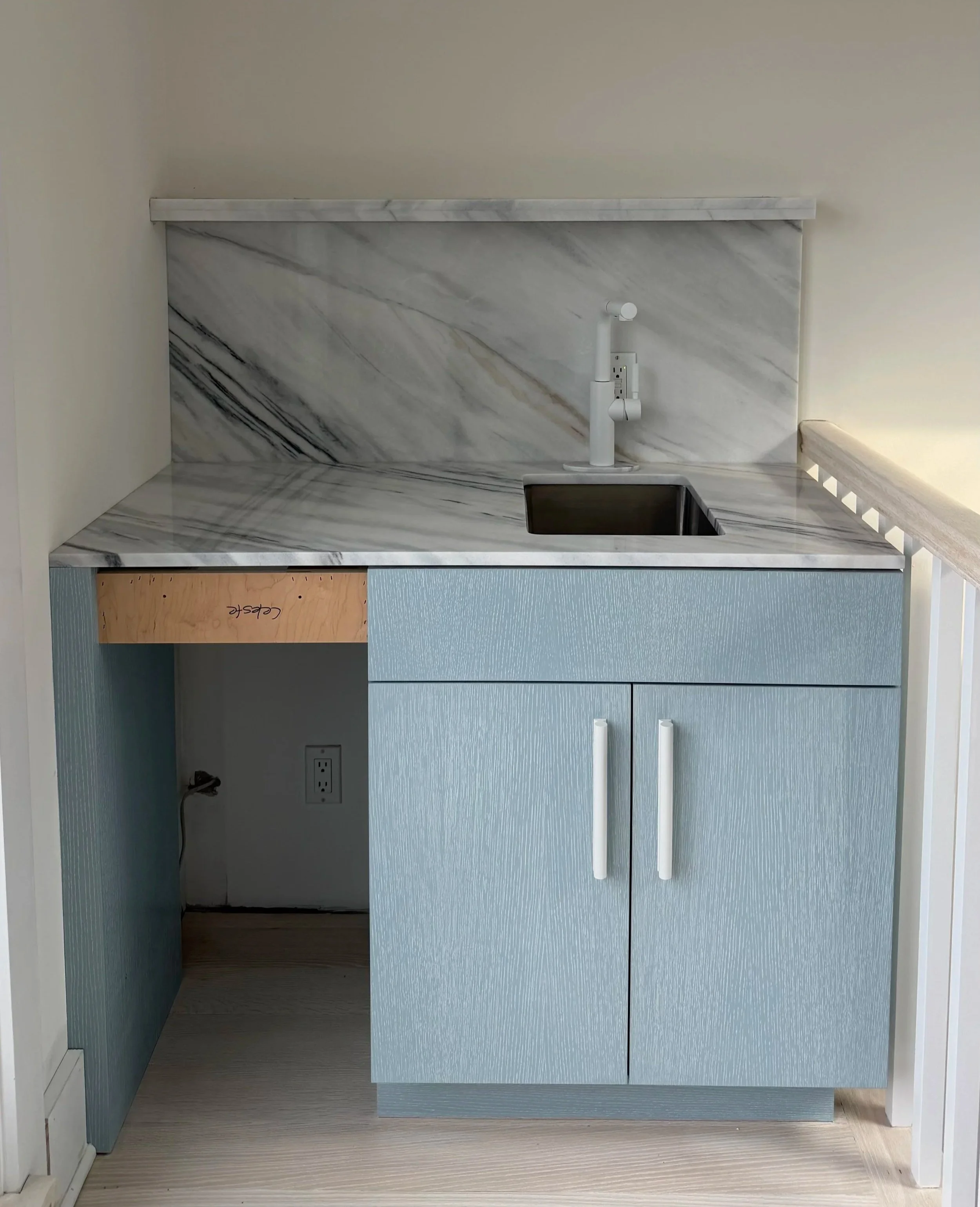 Bianco Lasa marble wet bar installation by Intermarble for a residential project in West Hampton Beach, New York