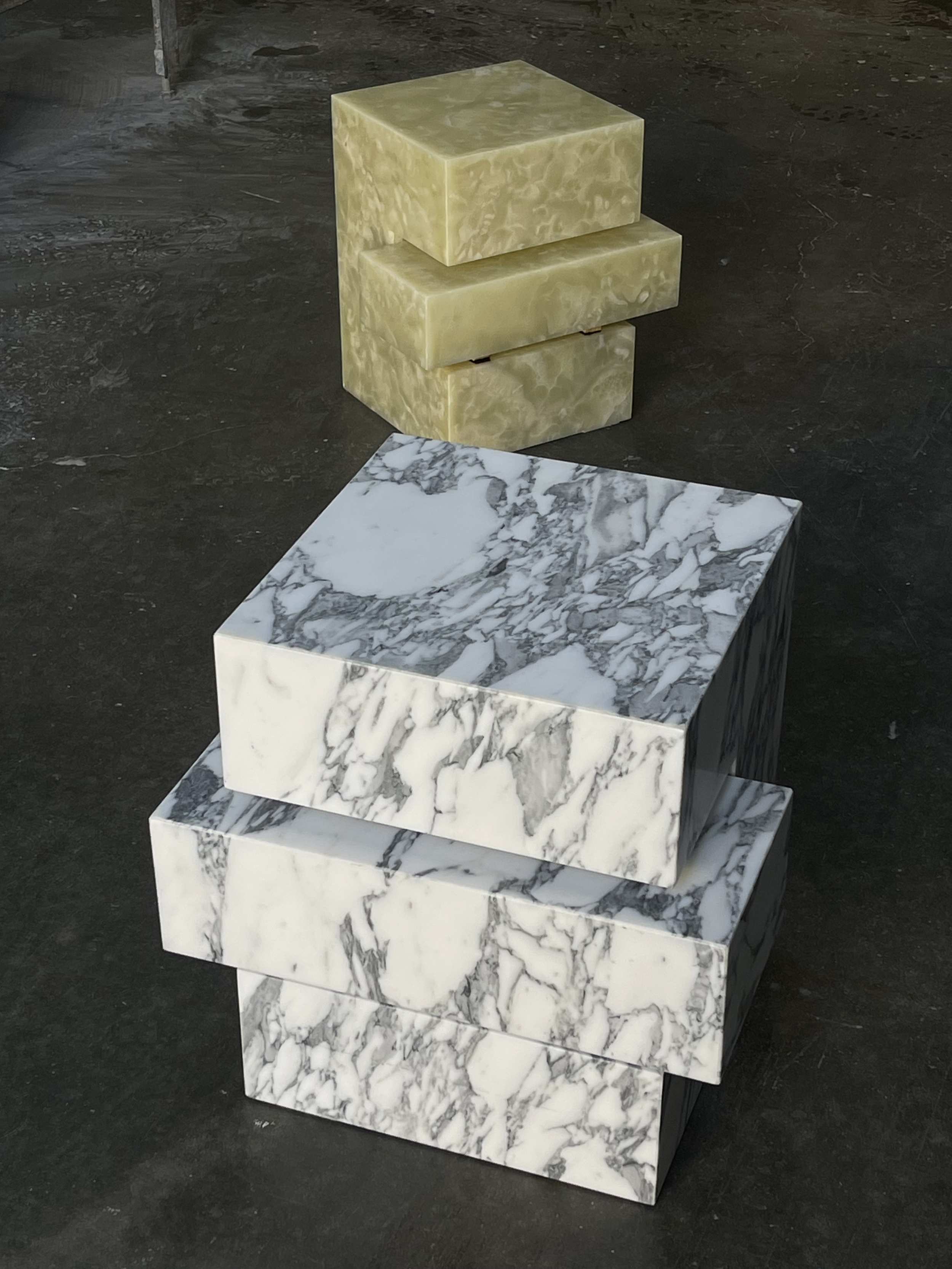 Stacked geometric side tables in Calacatta marble and light green onyx, handcrafted by Intermarble as collectible stone furniture pieces in New York