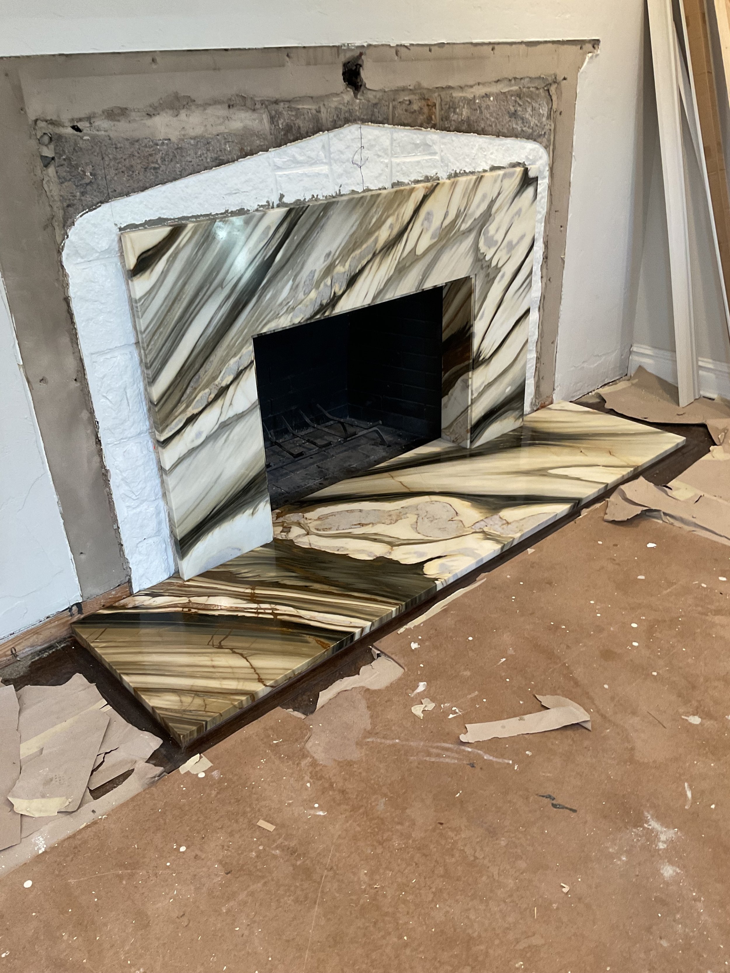 Macchia Vecchia slab fireplace surround in Long Island, NY, by Intermarble