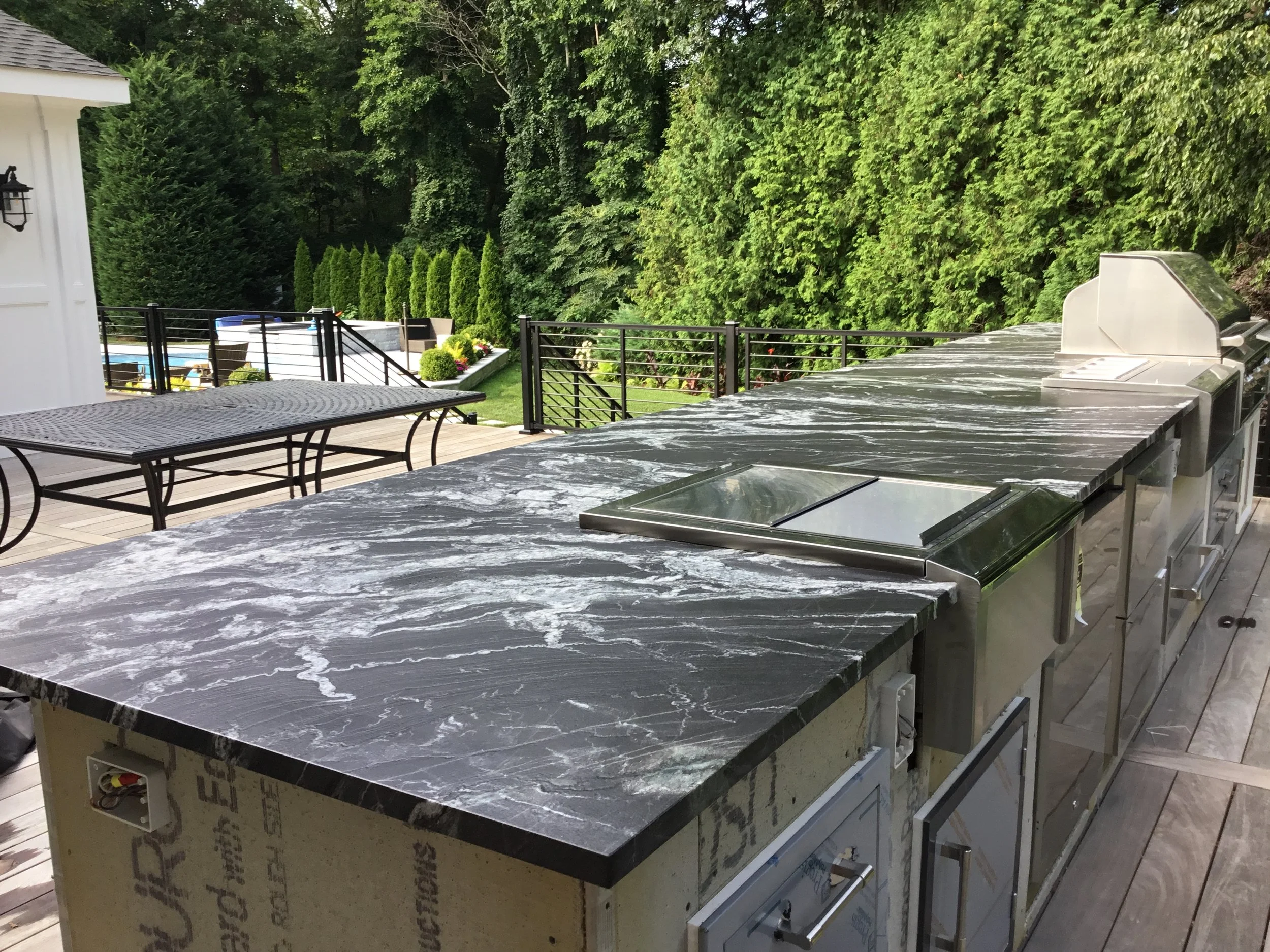 leathered granite outdoor kitchen installation by intermarble on long island, ny