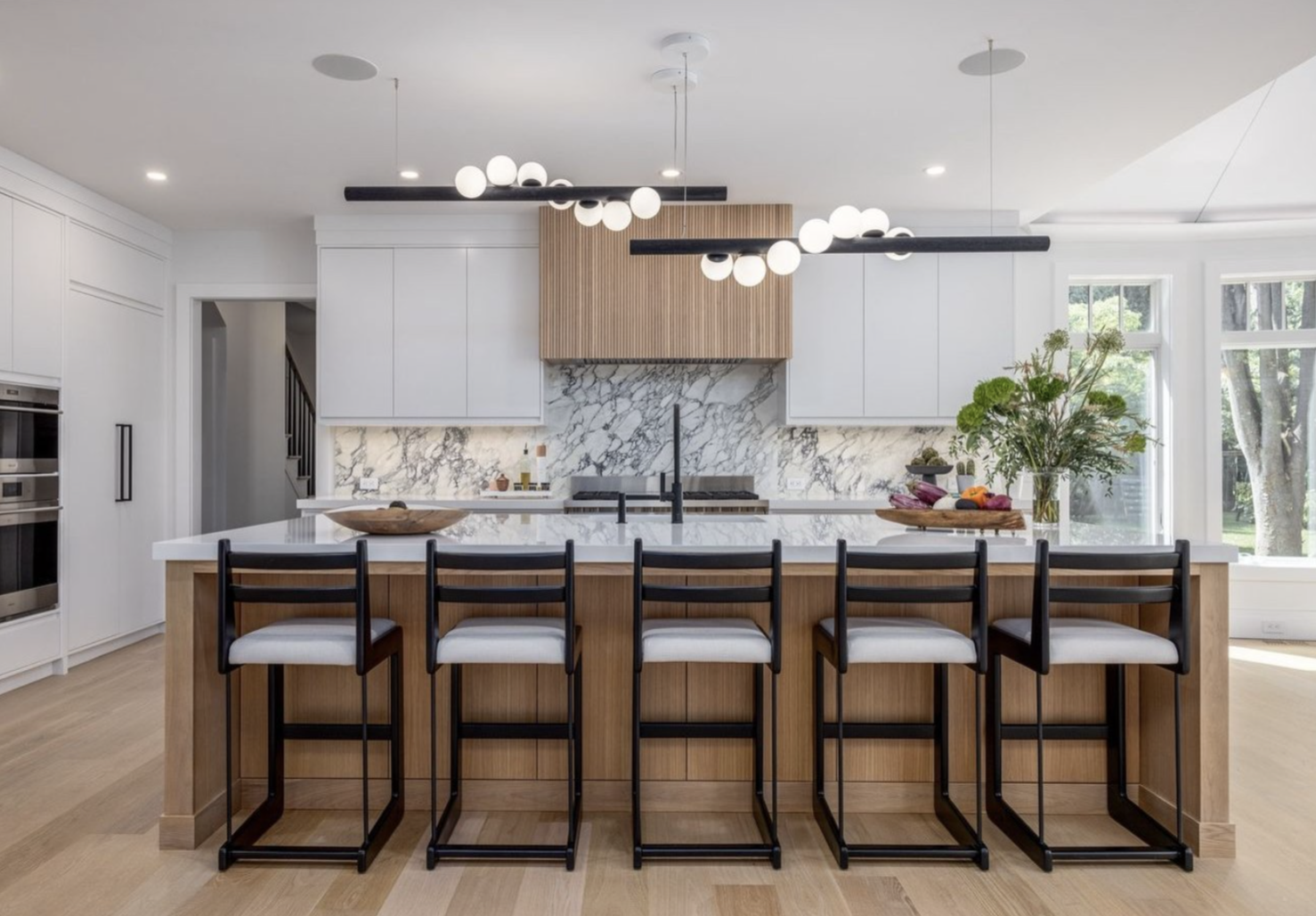 Marble kitchen island and backsplash installation by Intermarble for a residential projects in Long Island, New York