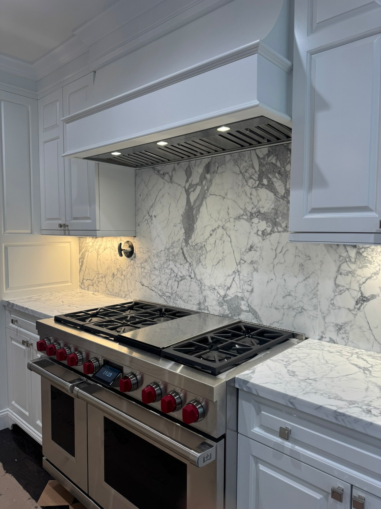 Statuario kitchen countertop and backsplash by Intermarble in Port Washington, New York