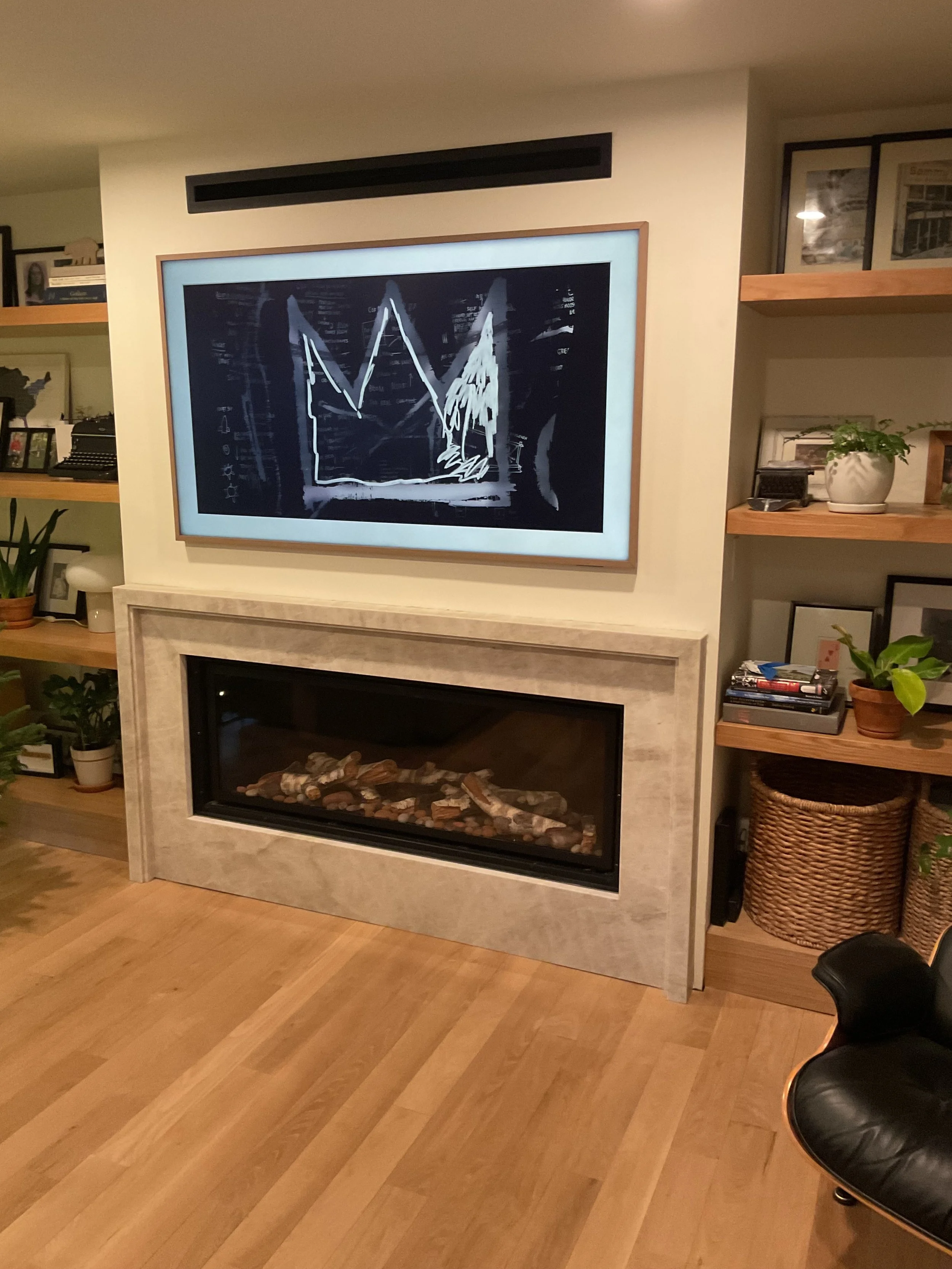 Custom-built Taj Mahal Quartzite mitered fireplace surround in Port Washington North. 