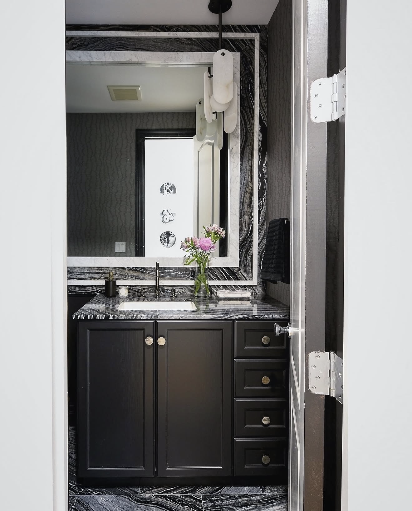 Kenya black bathroom vanity top and custom mirror frame by Intermarble. Sands Point, New York. 