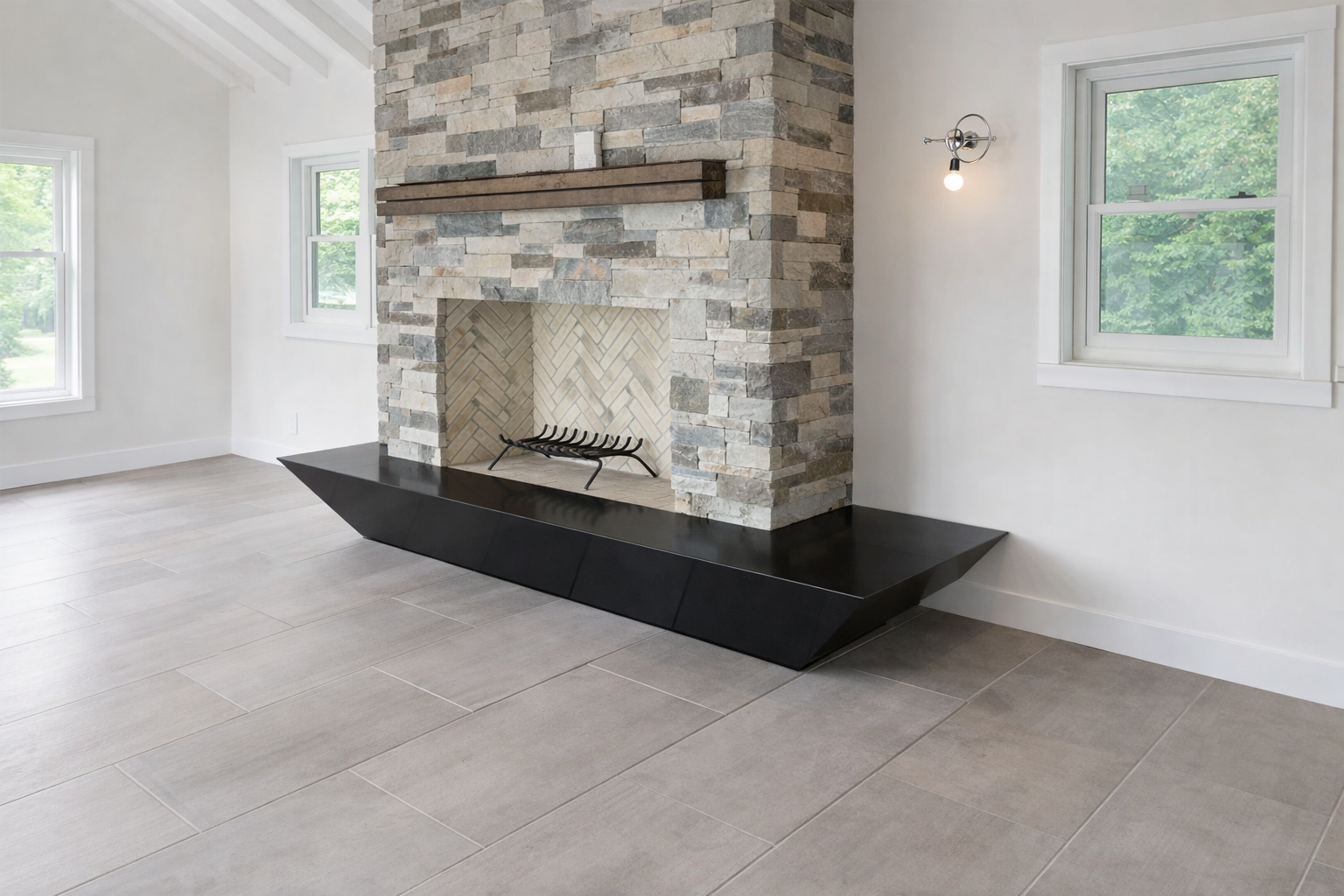 Black absolute granite fireplace hearth by Intermarble. Sands Point, New York