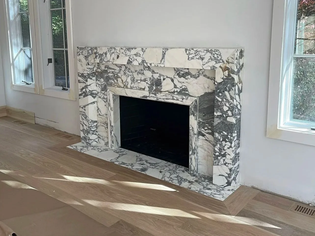 arabescato corchia marble fireplace surround by intermarble in port washington, ny