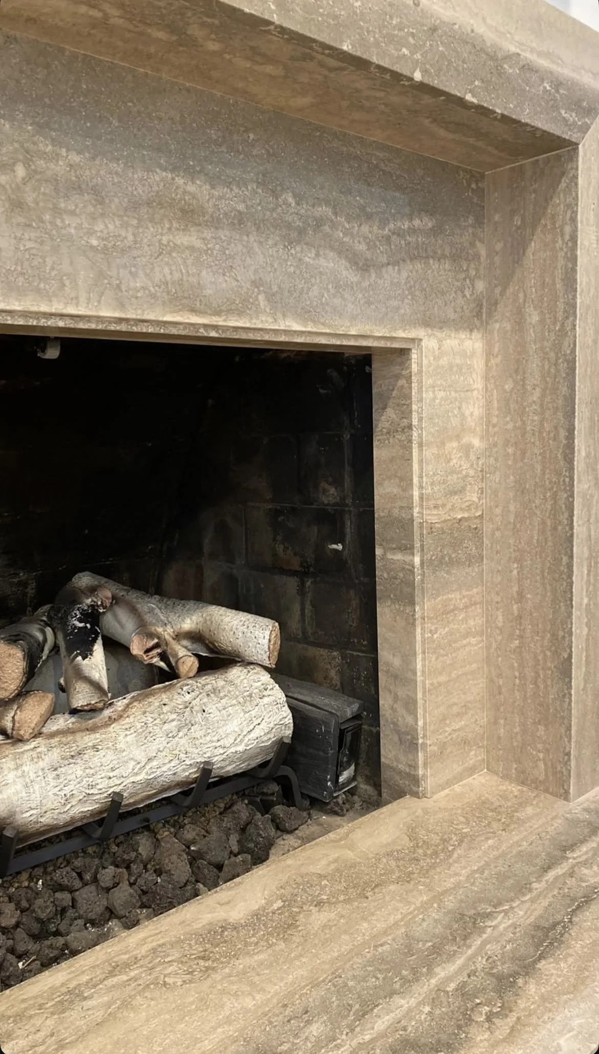 Travertine notched fireplace by Intermarble. Long Island, New York