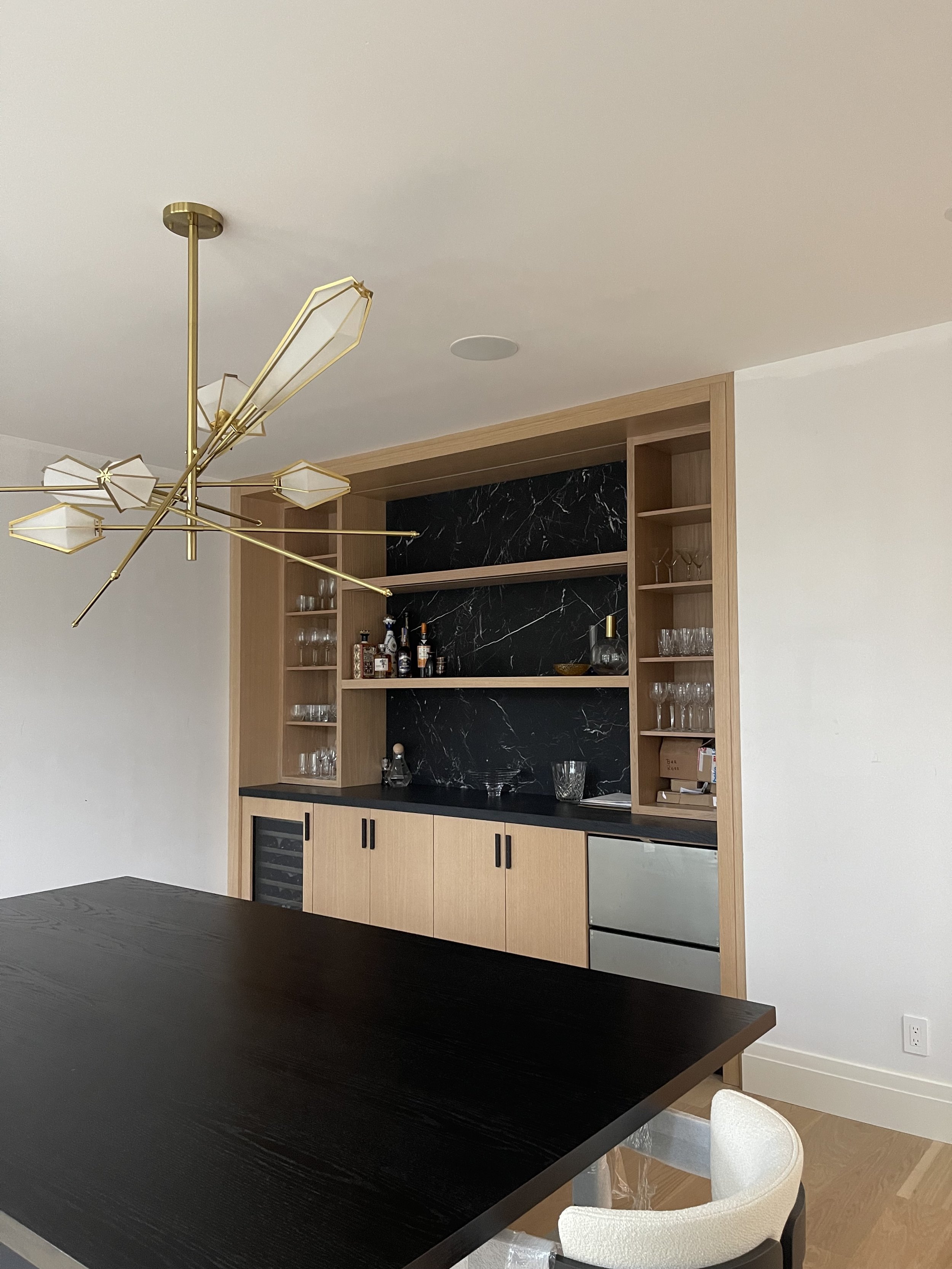 Honed nero marquina bar backsplash by Intermarble. Sands Point, New York