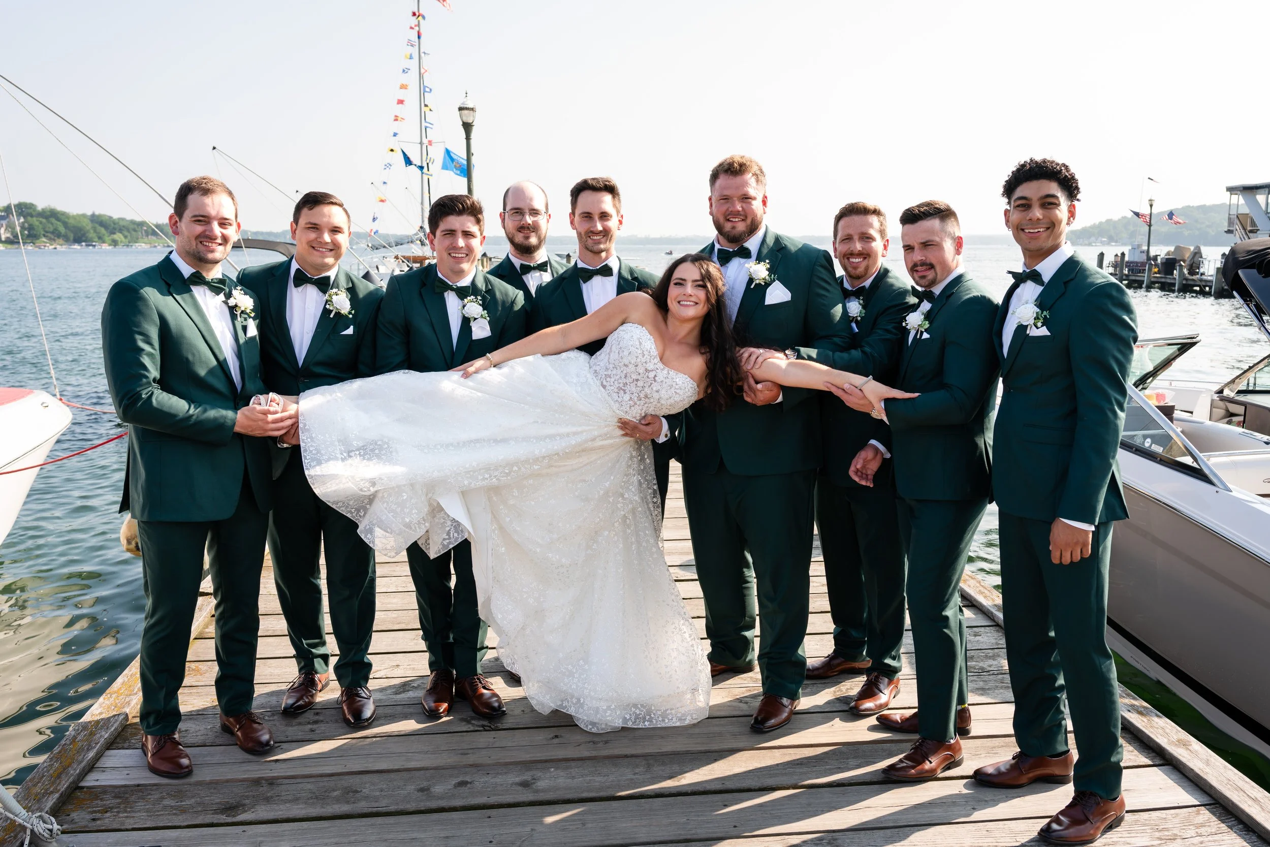 Groomsmen holding a bride