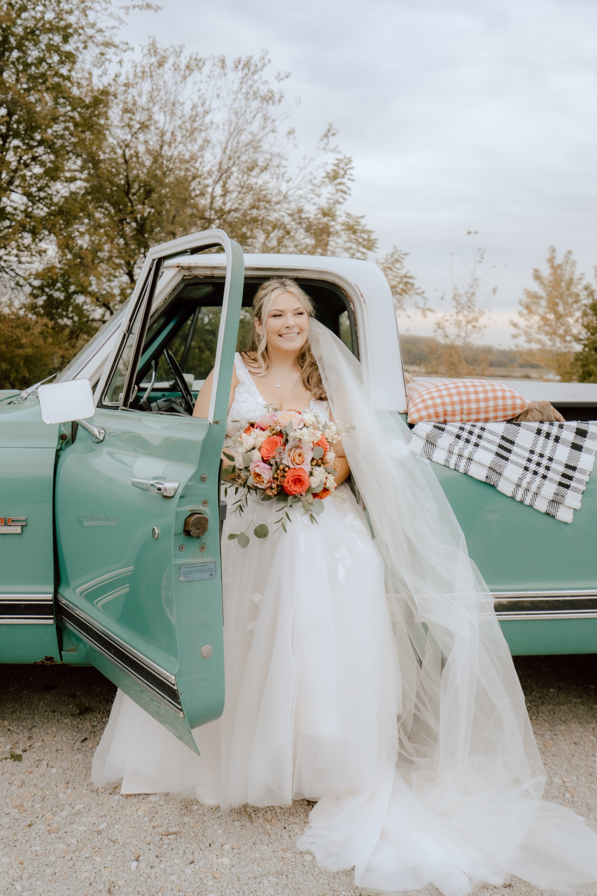 A girl smiling in a truck