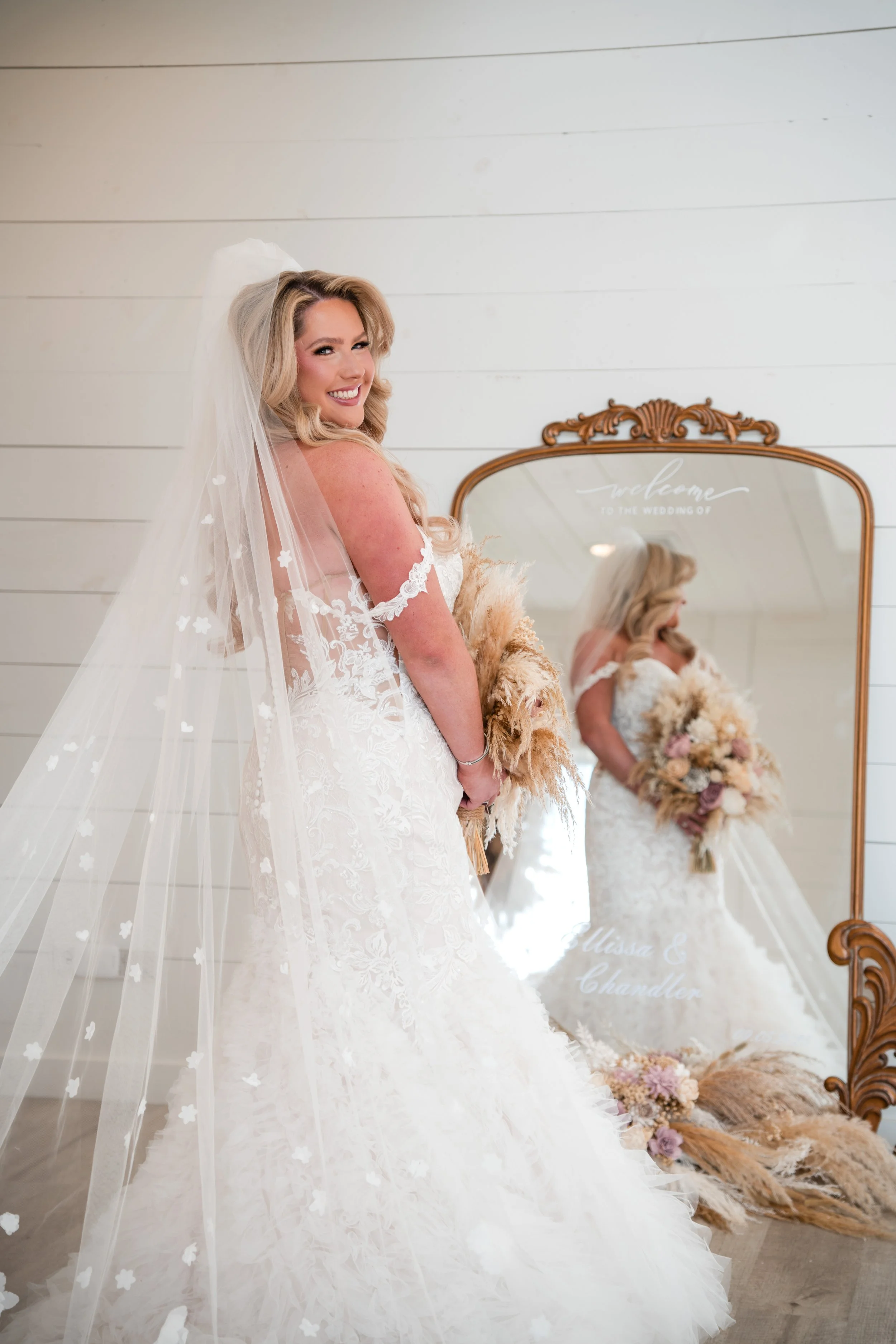 A bride in front of a mirror