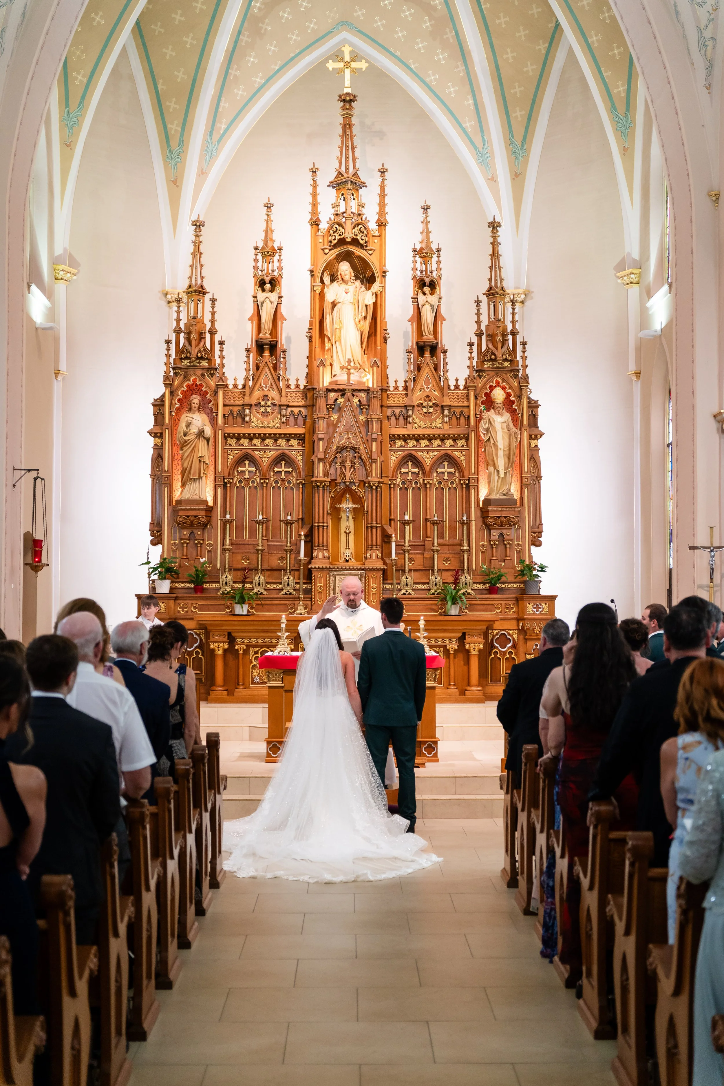 A bride and groom in a Catholic church