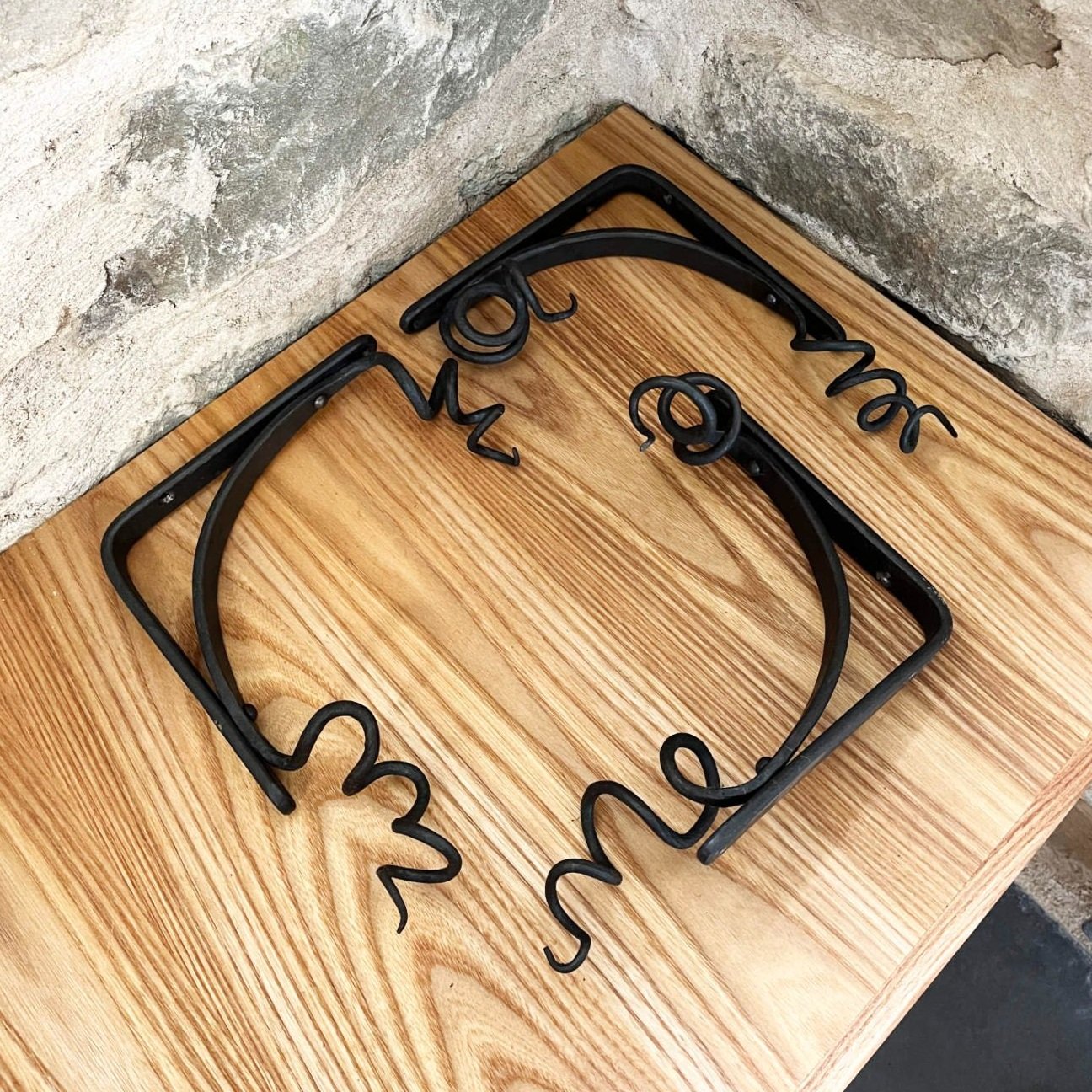 handmade blacksmith forged curling vine shelf brackets