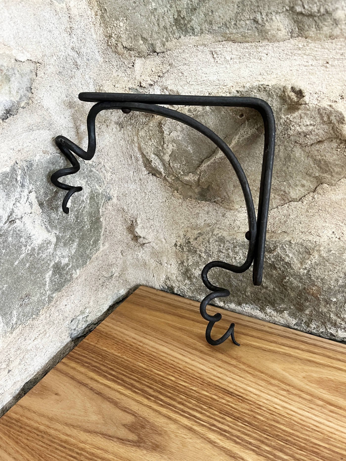 handmade blacksmith forged curling vine shelf brackets