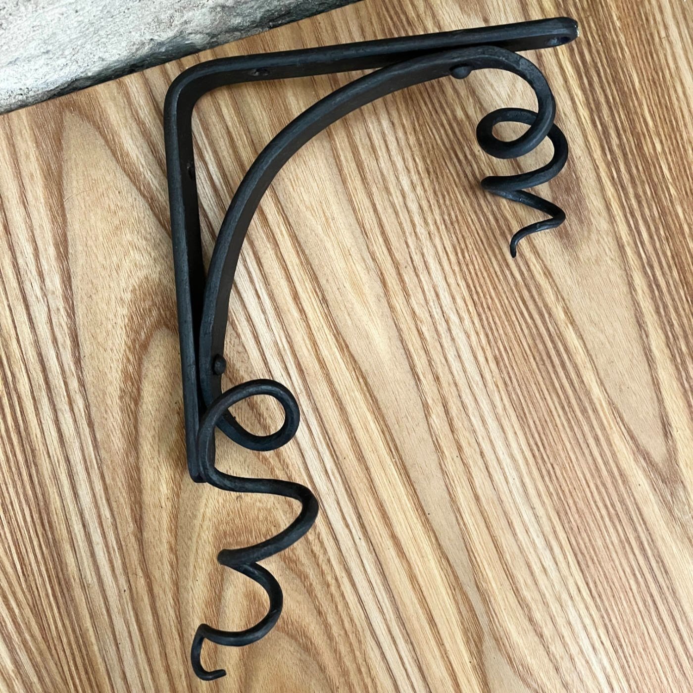 handmade blacksmith forged curling vine shelf brackets