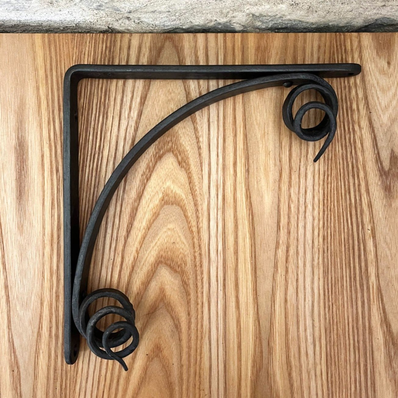 handmade blacksmith forged curling vine shelf brackets