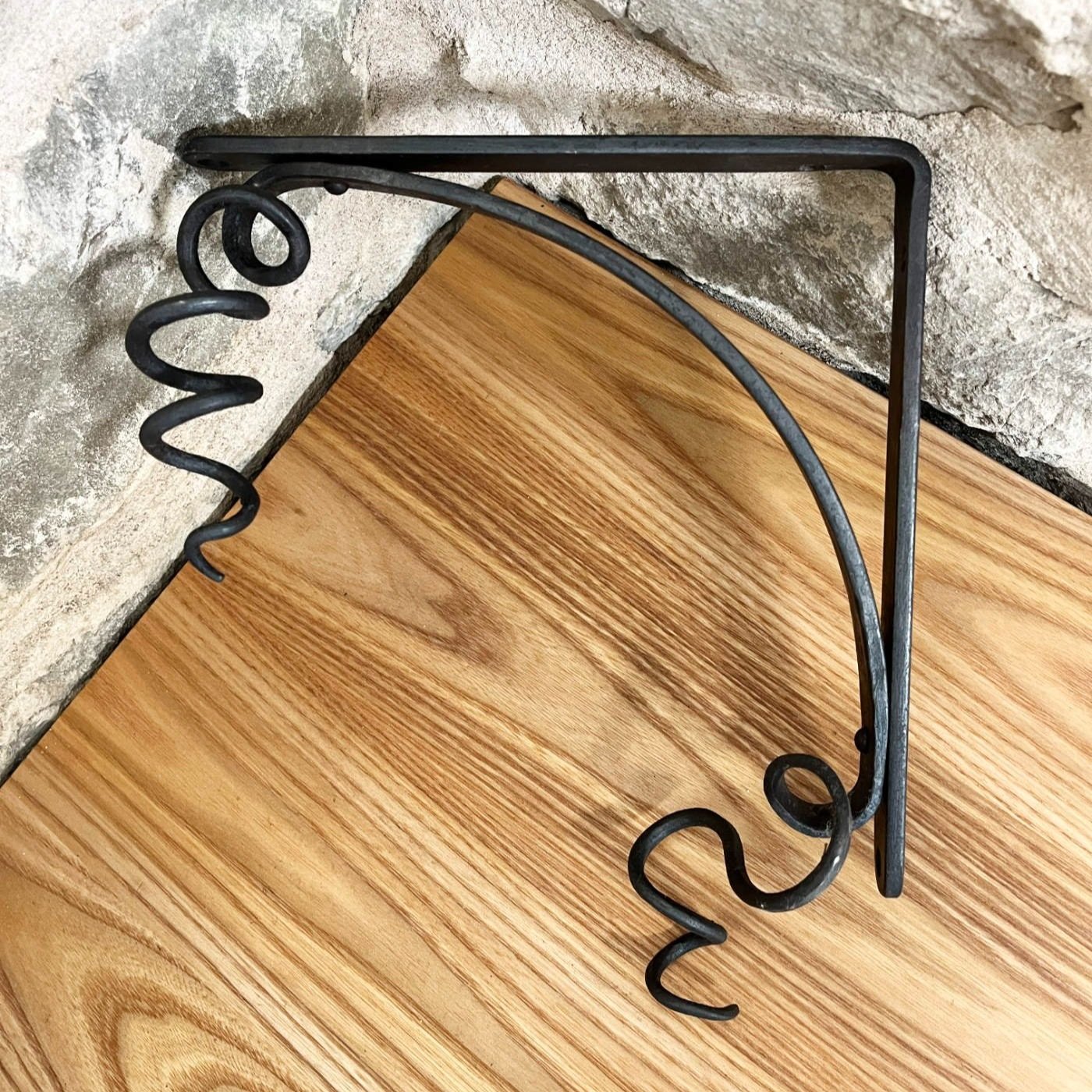 handmade blacksmith forged curling vine shelf brackets