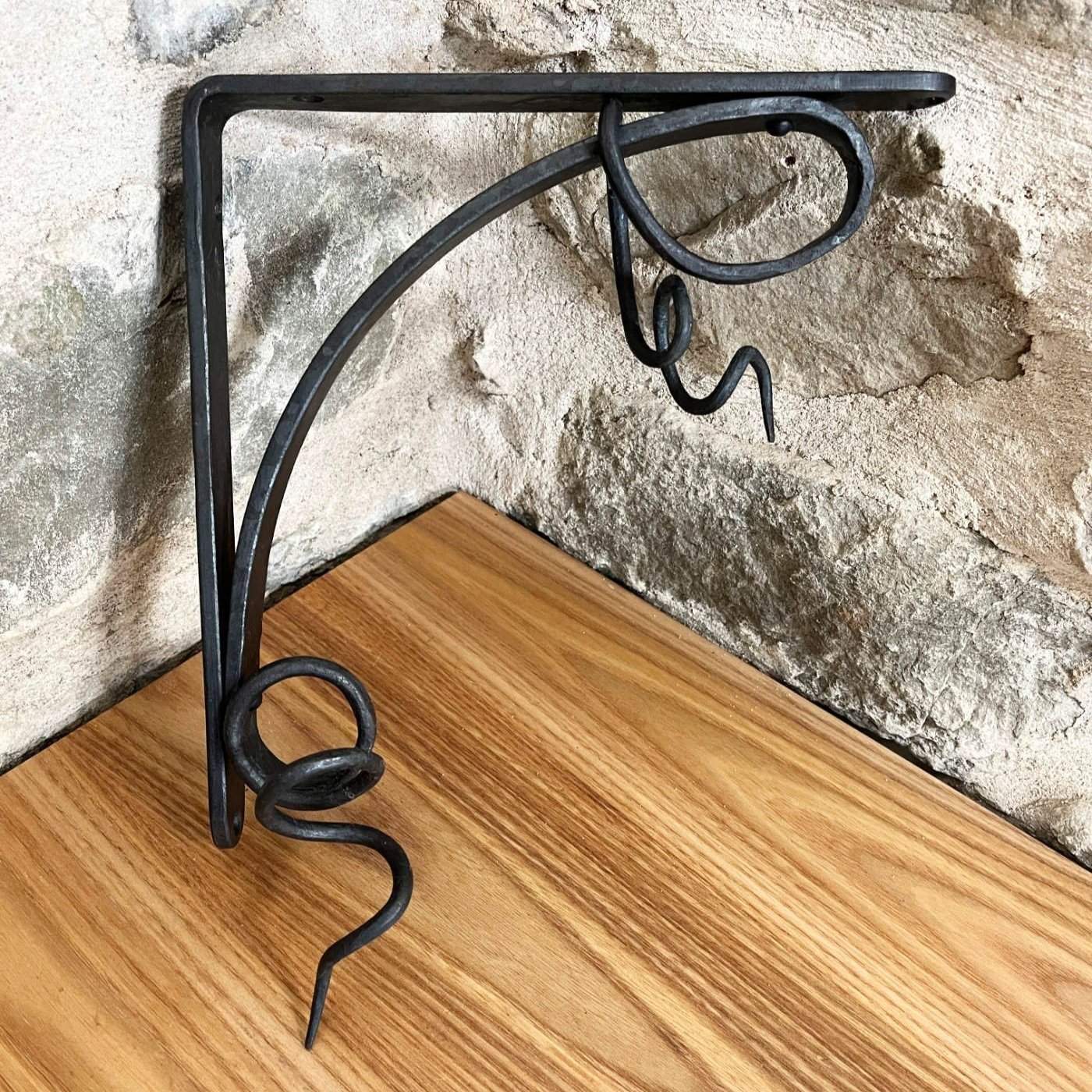 handmade blacksmith forged curling vine shelf brackets