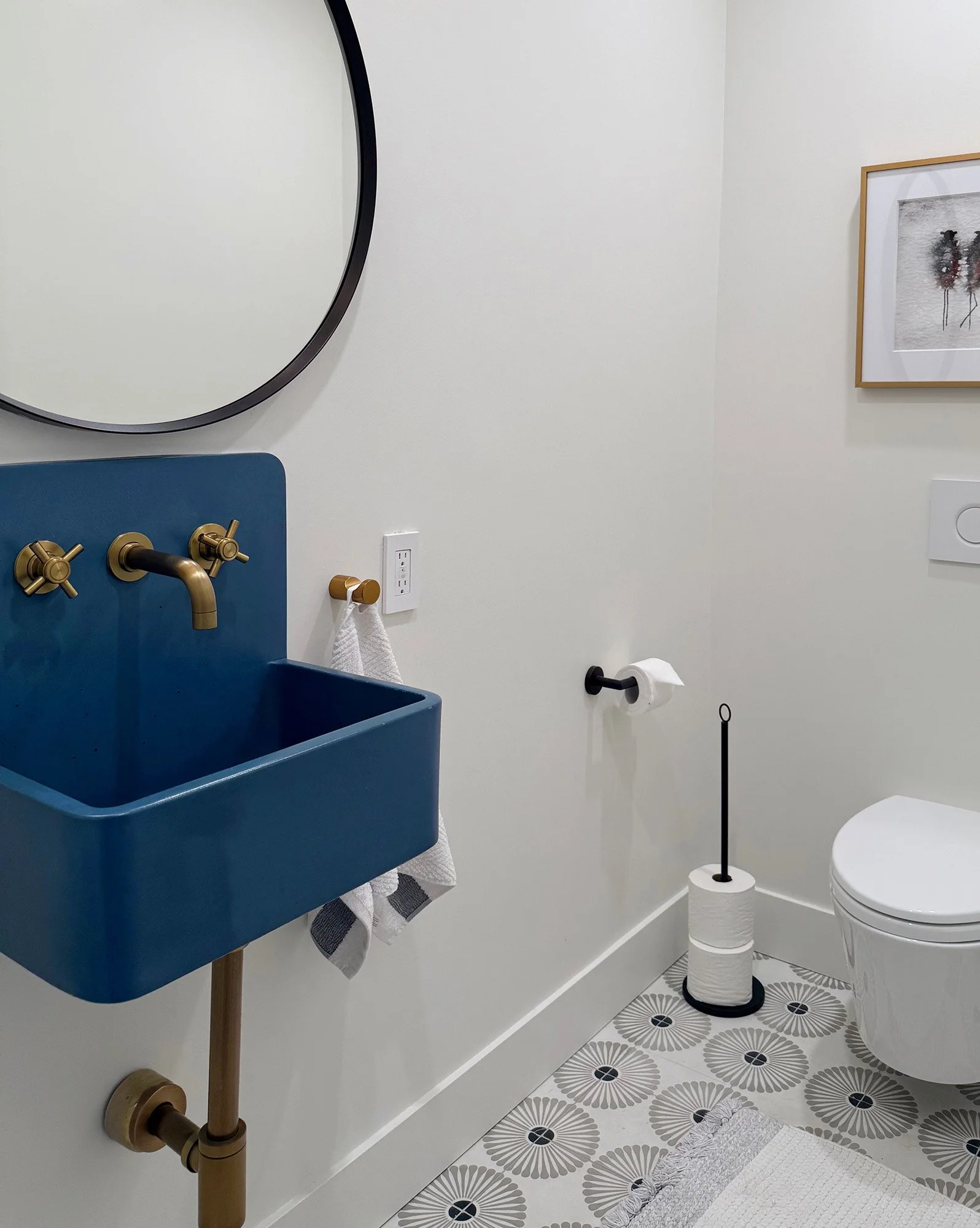 Small powder room with blue concrete sink in Corte Madera home