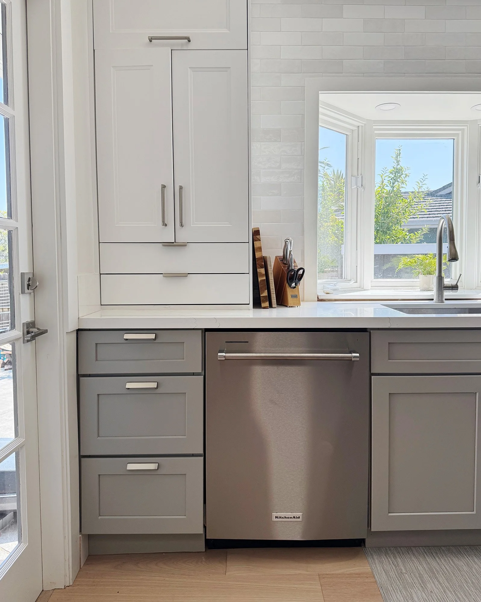 Kitchen with gray cabinetry in a calm, functional layout
