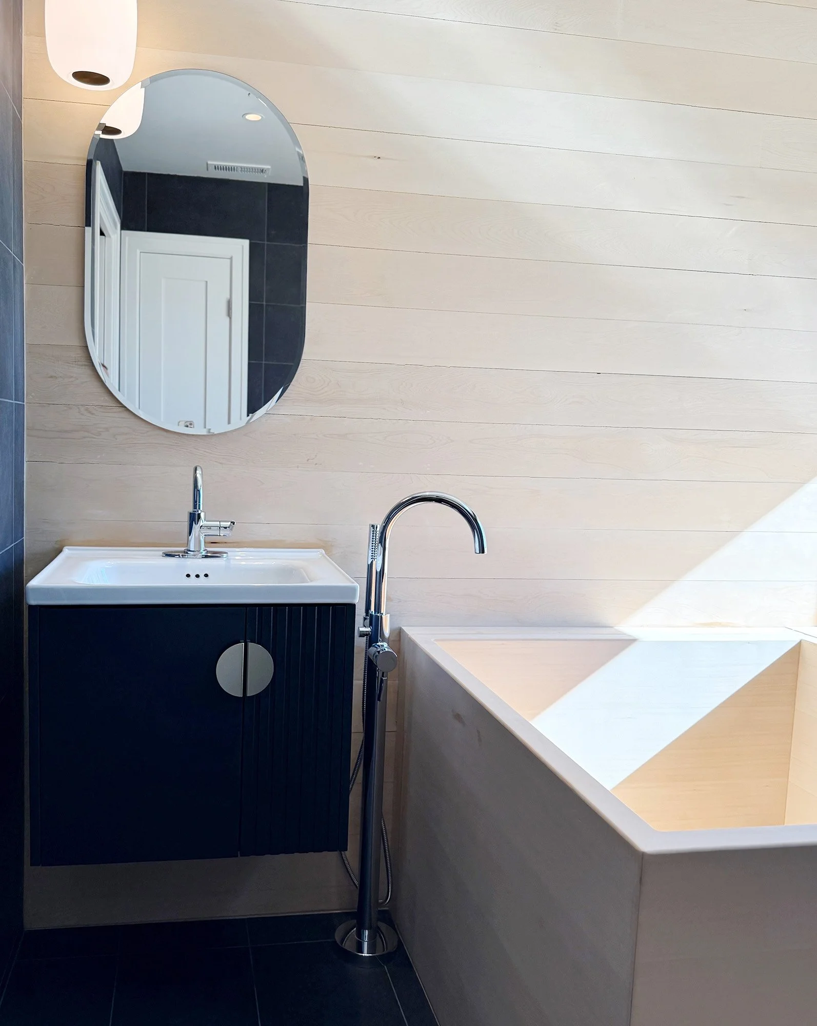 Bathroom vanity with wood cabinetry and integrated sink in San Carlos