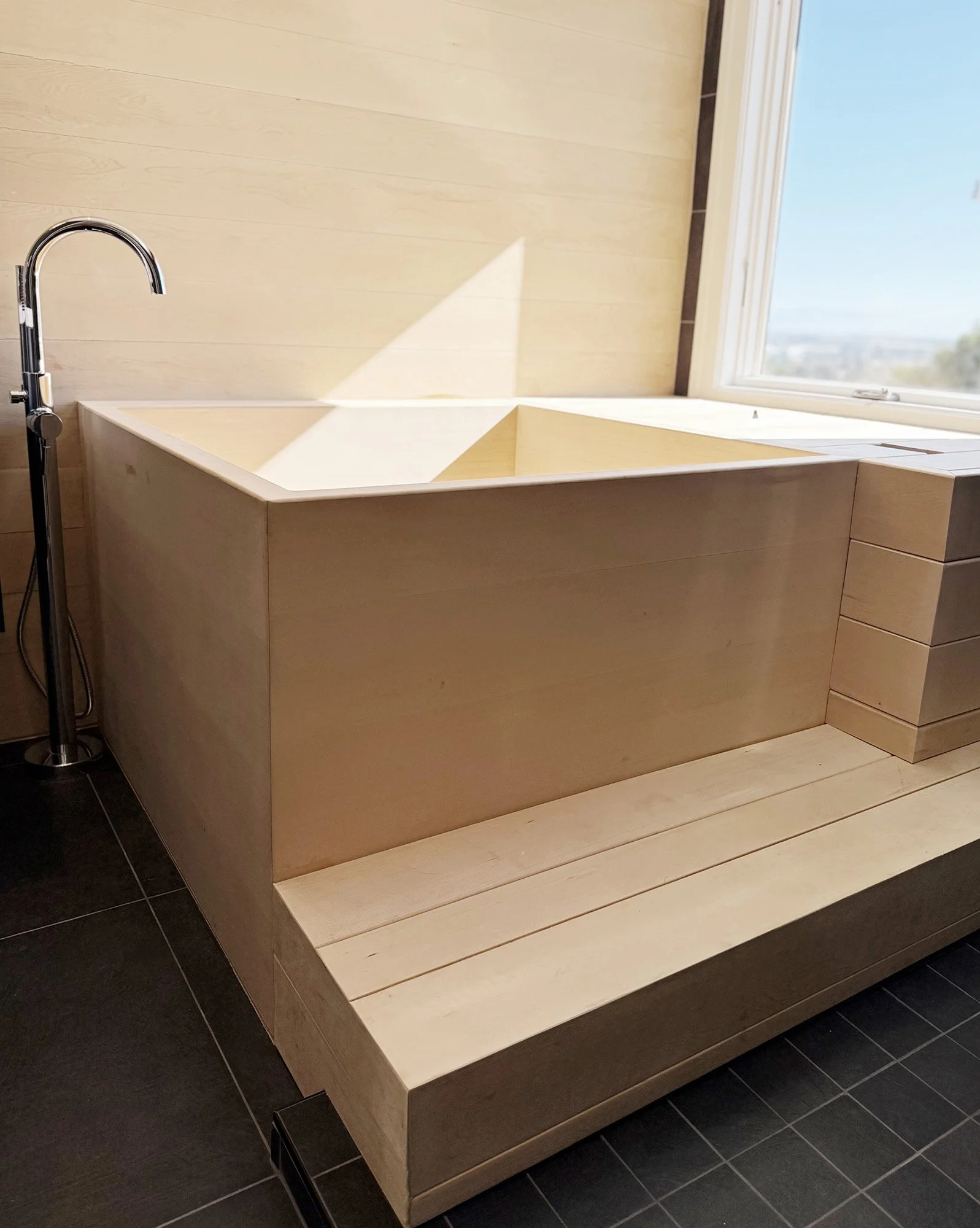 Wood ofuro soaking tub with step detail in San Carlos bathroom