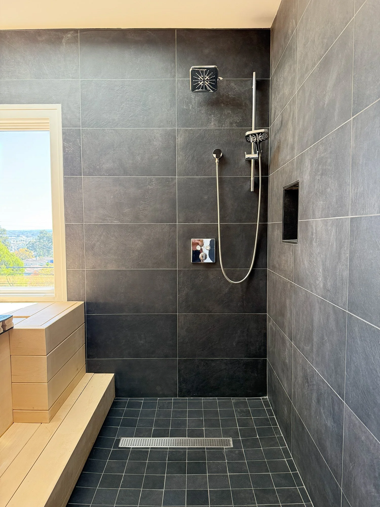 Tile shower with glass enclosure in San Carlos bathroom