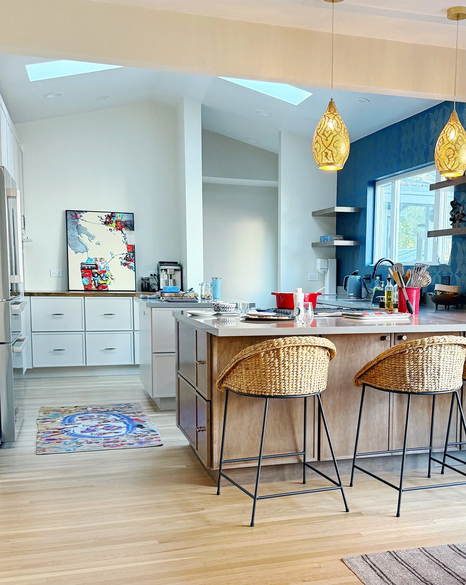 Kitchen with island seating and skylights in Sebastopol home